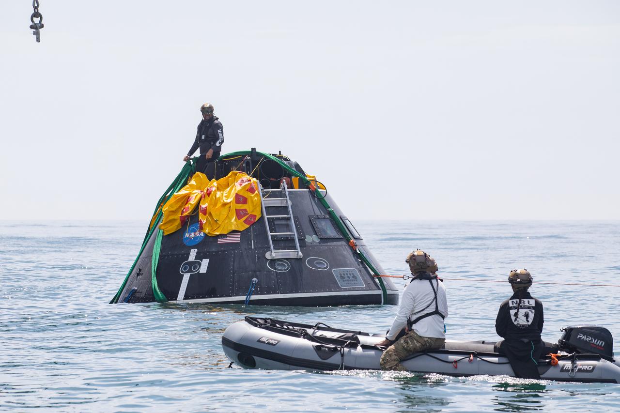 Teams with NASA and the Department of Defense (DoD) rehearse recovery procedures for a launch pad abort scenario off the coast of Florida near the agency’s Kennedy Space Center on Wednesday, June 11, 2025. Utilizing mannequin crew members inside the Crew Module Test Article (CMTA) – a full-scale mockup of the Orion spacecraft – the simulations practiced abort timelines and joint NASA and DoD recovery procedures supported by Artemis II launch and flight control teams, as NASA prepares to send four astronauts around the Moon and back next year as part of the agency’s first crewed Artemis mission.