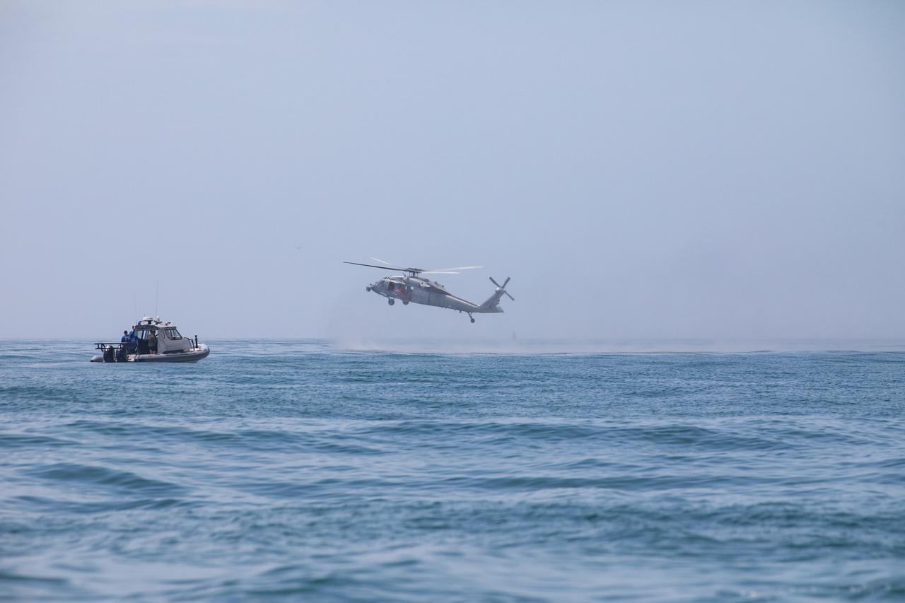 Teams with NASA and the Department of Defense (DoD) rehearse recovery procedures for a launch pad abort scenario off the coast of Florida near the agency’s Kennedy Space Center on Wednesday, June 11, 2025. Utilizing mannequin crew members inside the Crew Module Test Article (CMTA) – a full-scale mockup of the Orion spacecraft – the simulations practiced abort timelines and joint NASA and DoD recovery procedures supported by Artemis II launch and flight control teams, as NASA prepares to send four astronauts around the Moon and back next year as part of the agency’s first crewed Artemis mission.