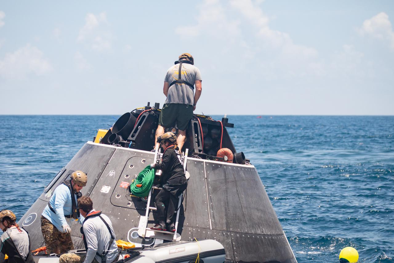 Teams with NASA and the Department of Defense (DoD) rehearse recovery procedures for an ascent abort scenario off the coast of Florida near the agency’s Kennedy Space Center on Thursday, June 12, 2025. Utilizing mannequin crew members inside the Crew Module Test Article (CMTA) – a full-scale mockup of the Orion spacecraft – the simulations practiced abort timelines and joint NASA and DoD recovery procedures supported by Artemis II launch and flight control teams, as NASA prepares to send four astronauts around the Moon and back next year as part of the agency’s first crewed Artemis mission.