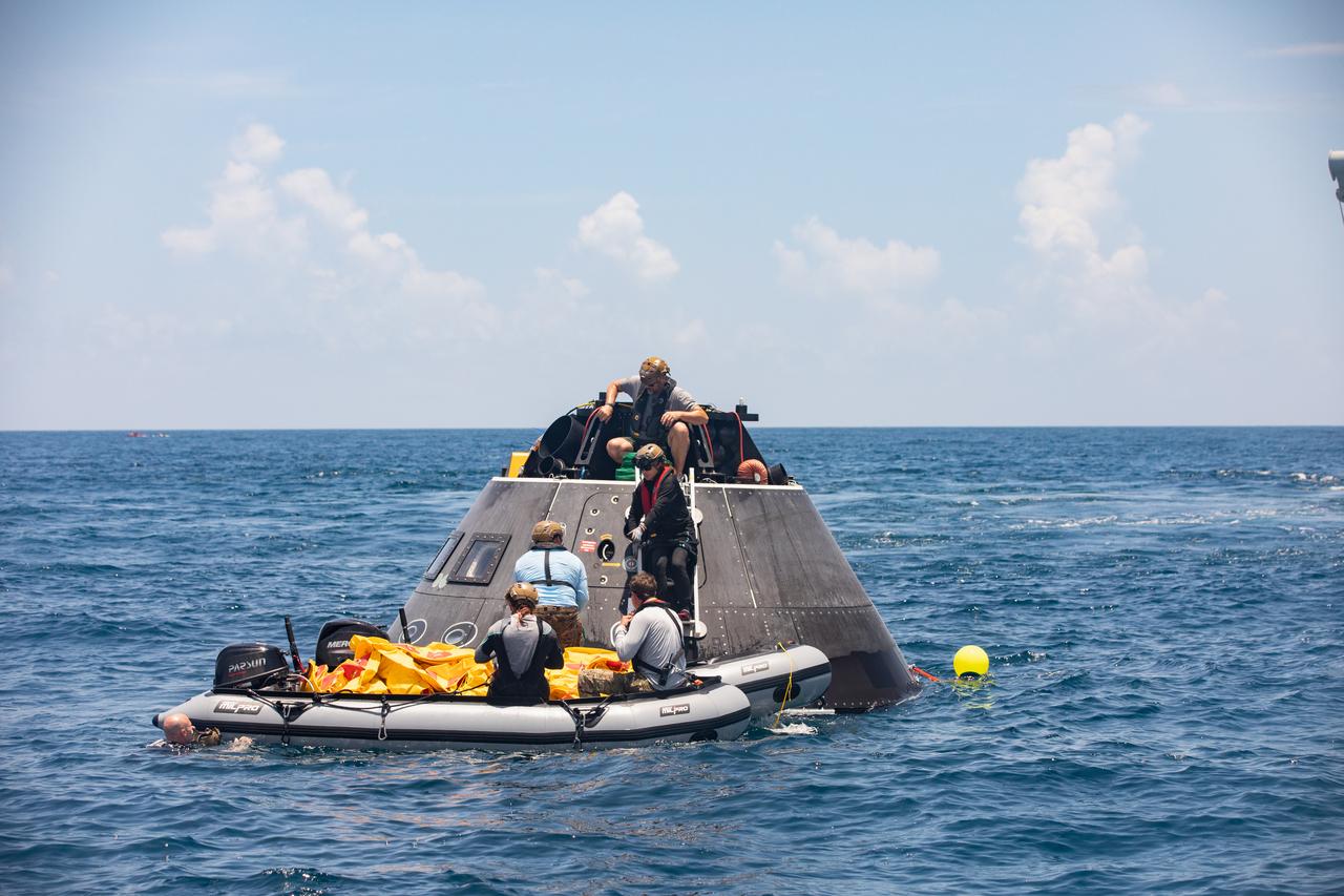 Teams with NASA and the Department of Defense (DoD) rehearse recovery procedures for an ascent abort scenario off the coast of Florida near the agency’s Kennedy Space Center on Thursday, June 12, 2025. Utilizing mannequin crew members inside the Crew Module Test Article (CMTA) – a full-scale mockup of the Orion spacecraft – the simulations practiced abort timelines and joint NASA and DoD recovery procedures supported by Artemis II launch and flight control teams, as NASA prepares to send four astronauts around the Moon and back next year as part of the agency’s first crewed Artemis mission.