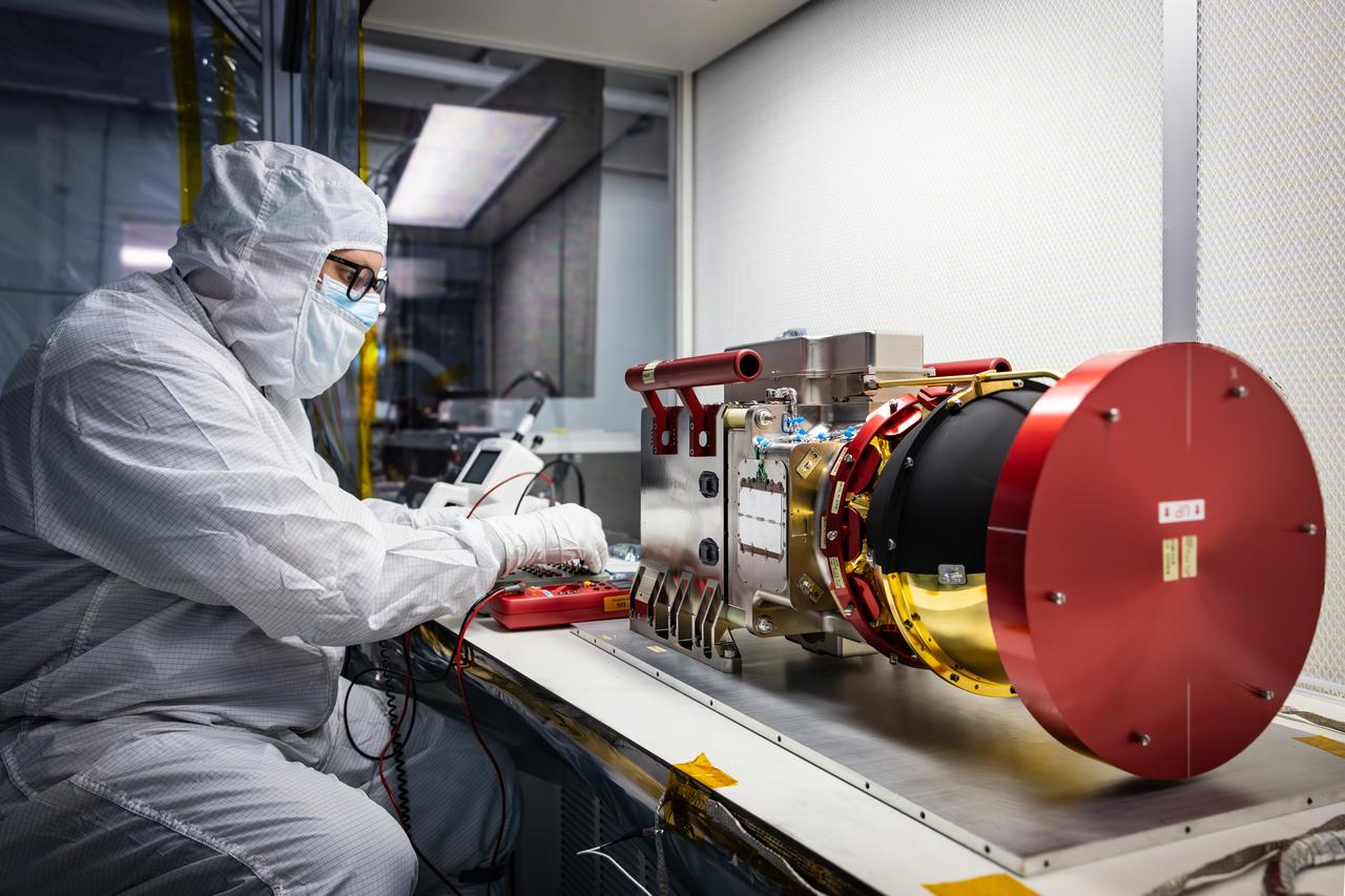A technician performs tests on the Compact Dual Ion Composition Experiment (CoDICE) instrument of NASA’s IMAP (Interstellar Mapping and Acceleration Probe) observatory inside the high bay at the Astrotech Space Operations Facility near the agency’s Kennedy Space Center in Florida on Tuesday, June 17, 2025. CoDICE will measure solar wind particles flowing from the Sun and pickup ions that entered the heliosphere from outside the solar system, as well as the direction of travel, and types of specific species of pickup ions. Launch of the IMAP mission is targeted for no earlier than September 2025 aboard a SpaceX Falcon 9 rocket from Launch Complex 39A at NASA Kennedy.