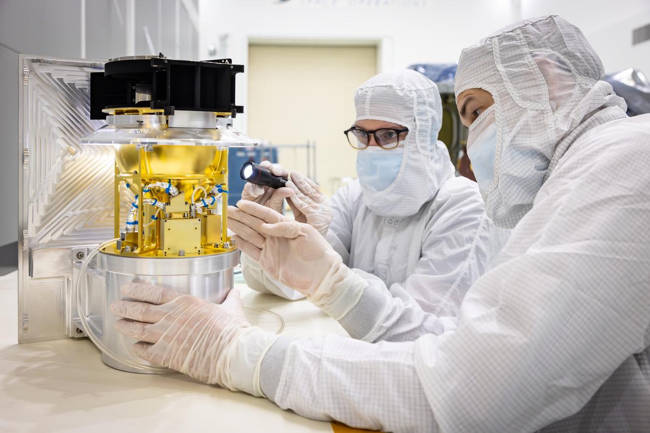 Technicians perform tests the Solar Wind and Pickup Ions (SWAPI) instrument of NASA’s IMAP (Interstellar Mapping and Acceleration Probe) observatory inside the high bay at the Astrotech Space Operations Facility near the agency’s Kennedy Space Center in Florida on Tuesday, June 17, 2025. As IMAP spins in space, solar wind particles are swept into SWAPI through a special opening called “sunglasses,” an opening covered by a screen with very tiny precise holes that cut down the brightness of the very intense solar wind. SWAPI collects and counts particles from the solar wind flowing from the Sun and particles called pick-up ions that have entered the heliosphere from outside the solar system and traveled inwards where IMAP orbits near Earth. Launch of the IMAP mission is targeted for no earlier than September 2025 aboard a SpaceX Falcon 9 rocket from Launch Complex 39A at NASA Kennedy.