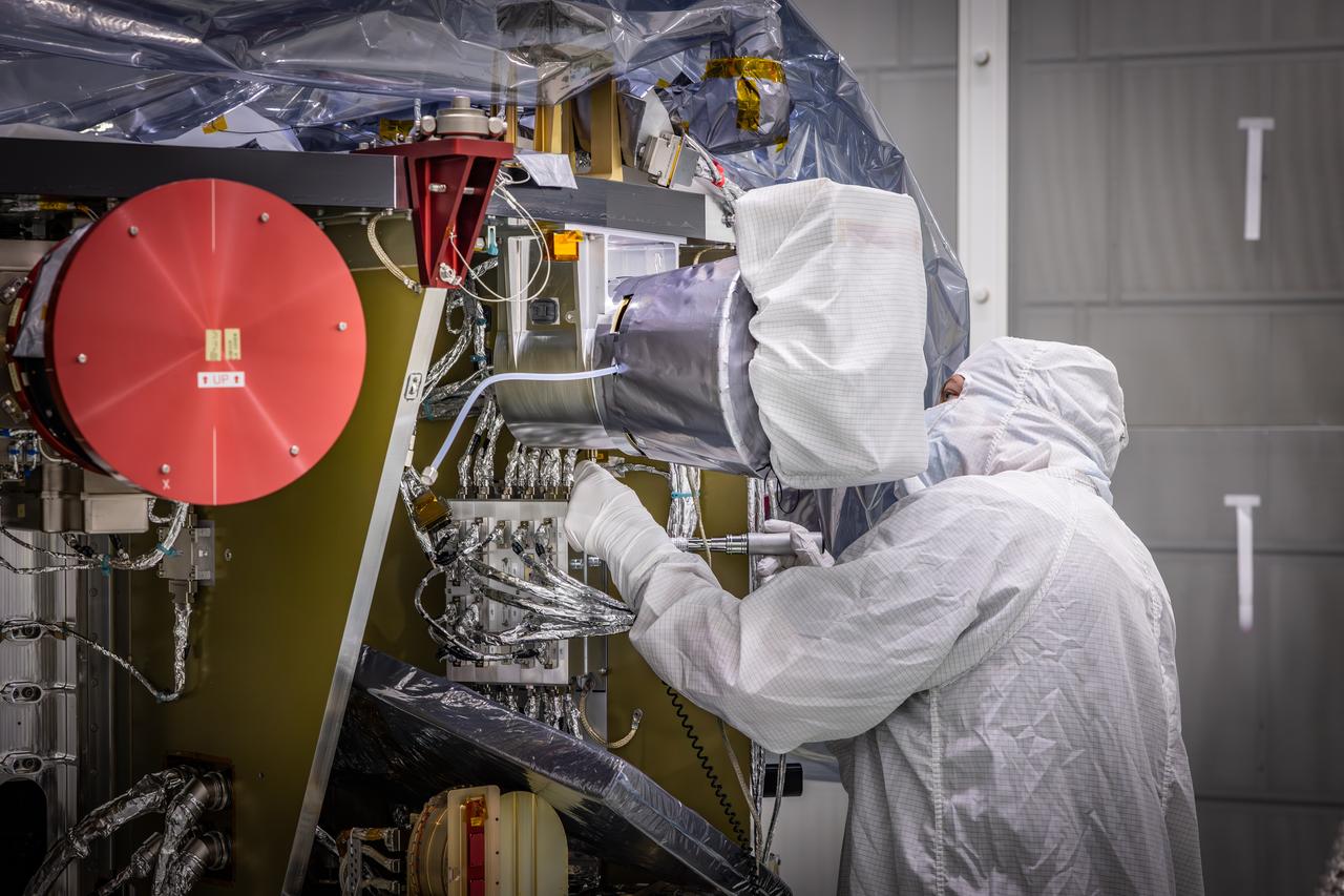 Technicians reintegrate the Solar Wind and Pickup Ions (SWAPI) instrument of NASA’s IMAP (Interstellar Mapping and Acceleration Probe) observatory inside the high bay at the Astrotech Space Operations Facility near the agency’s Kennedy Space Center in Florida on Monday, June 23, 2025. As IMAP spins in space, solar wind particles are swept into SWAPI through a special opening called “sunglasses,” an opening covered by a screen with very tiny precise holes that cut down the brightness of the very intense solar wind. SWAPI collects and counts particles from the solar wind flowing from the Sun and particles called pick-up ions that have entered the heliosphere from outside the solar system and traveled inwards where IMAP orbits near Earth. Launch of the IMAP mission is targeted for no earlier than September 2025 aboard a SpaceX Falcon 9 rocket from Launch Complex 39A at NASA Kennedy.