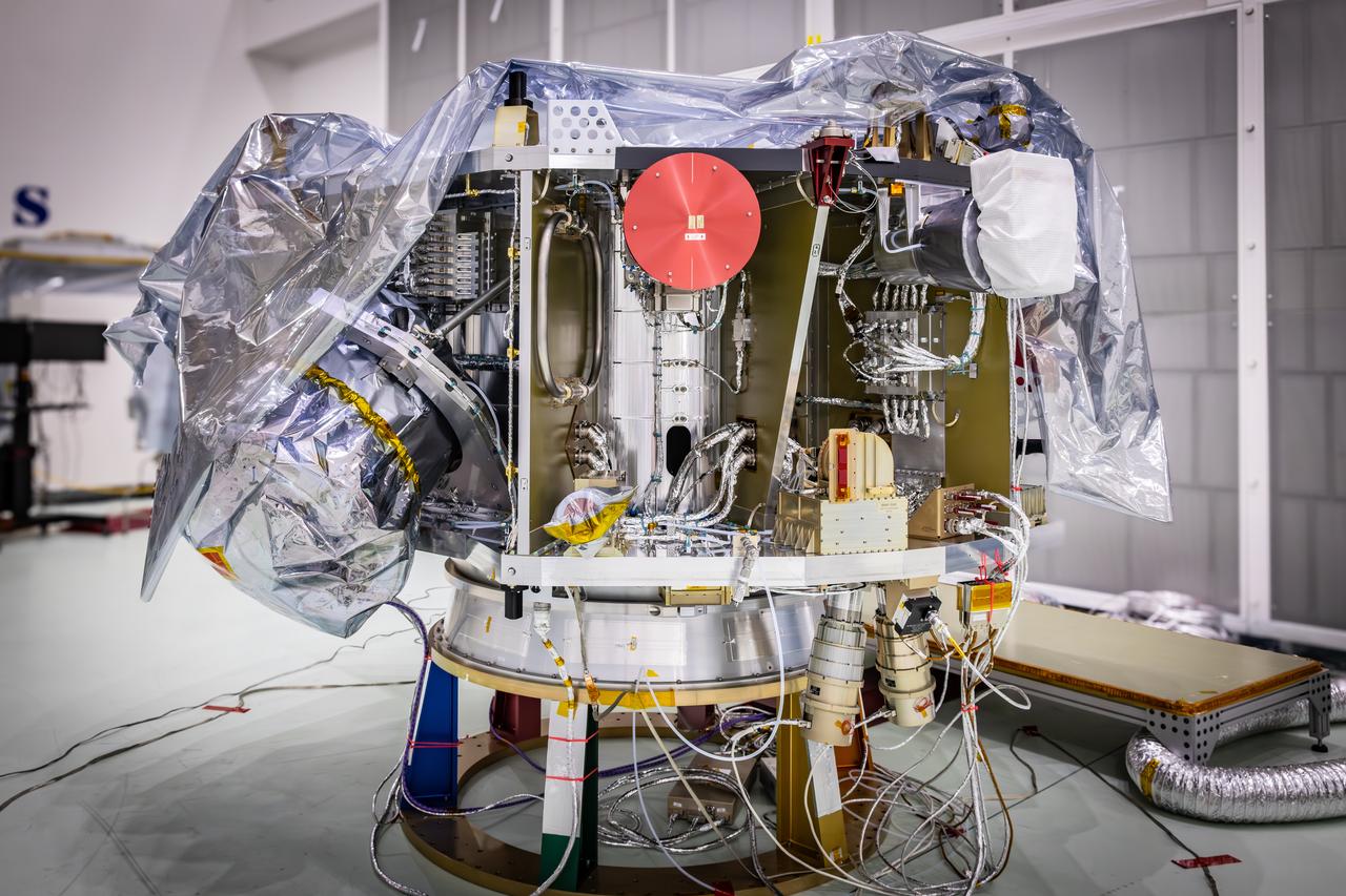 Technicians reintegrate the Solar Wind and Pickup Ions (SWAPI) instrument of NASA’s IMAP (Interstellar Mapping and Acceleration Probe) observatory inside the high bay at the Astrotech Space Operations Facility near the agency’s Kennedy Space Center in Florida on Monday, June 23, 2025. As IMAP spins in space, solar wind particles are swept into SWAPI through a special opening called “sunglasses,” an opening covered by a screen with very tiny precise holes that cut down the brightness of the very intense solar wind. SWAPI collects and counts particles from the solar wind flowing from the Sun and particles called pick-up ions that have entered the heliosphere from outside the solar system and traveled inwards where IMAP orbits near Earth. Launch of the IMAP mission is targeted for no earlier than September 2025 aboard a SpaceX Falcon 9 rocket from Launch Complex 39A at NASA Kennedy.