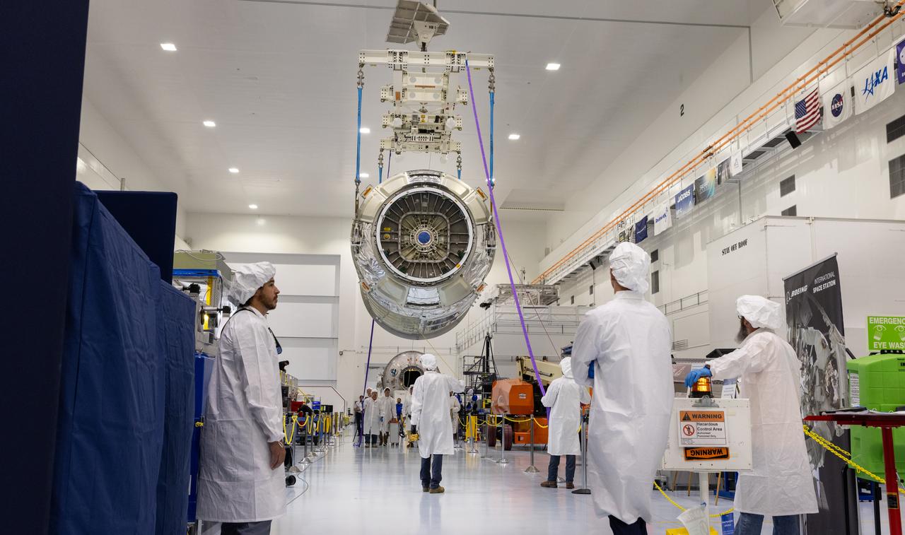 Technicians use a crane to lift Northrop Grumman Cygnus spacecraft’s pressurized cargo module out of the shipping container on Thursday, July 10, 2025, inside the Space Systems Processing Facility at NASA’s Kennedy Space Center in Florida. The new extended Cygnus capsule, scheduled to launch no earlier than fall 2025, will carry supplies, food, and scientific experiments for crew members at the International Space Station as part of the company’s 23rd cargo resupply mission.