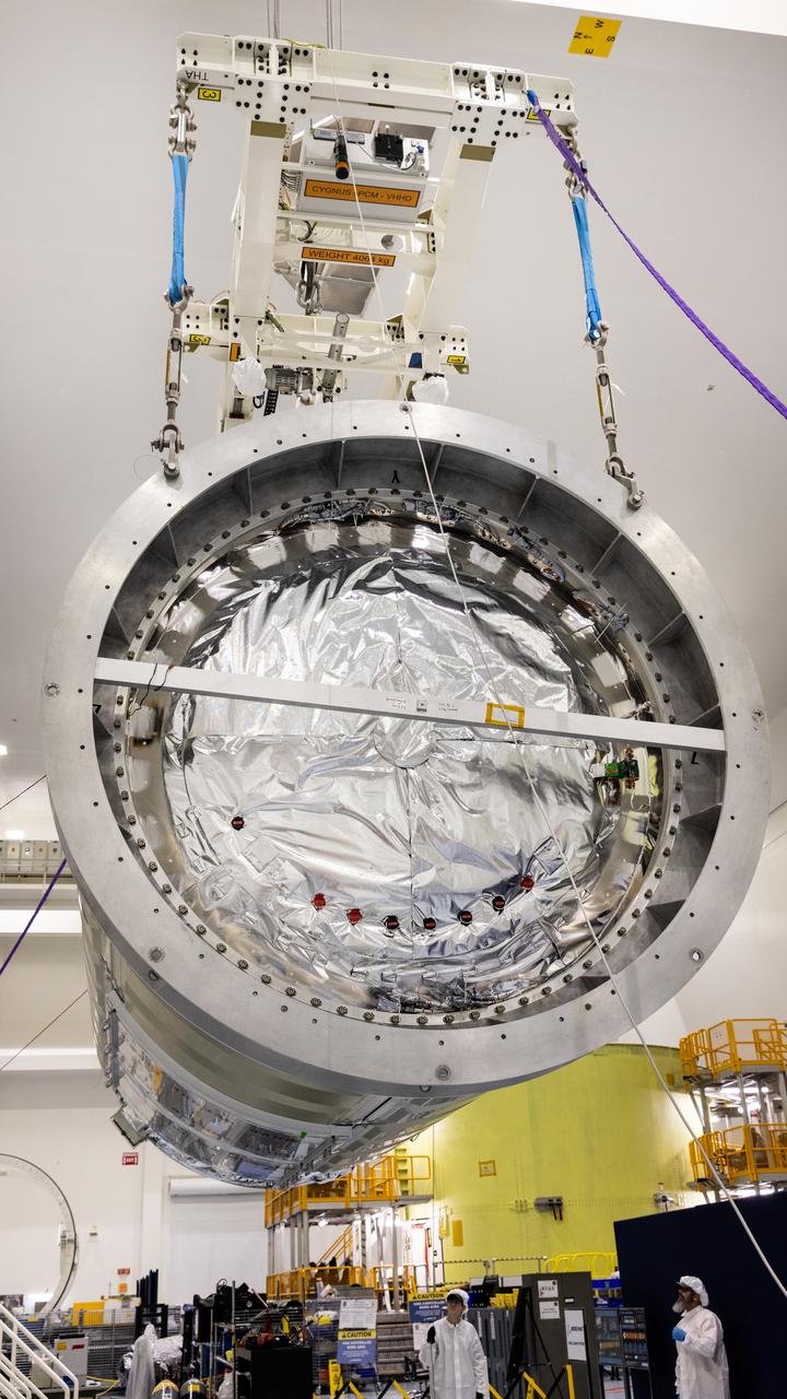 Technicians use a crane to lift Northrop Grumman Cygnus spacecraft’s pressurized cargo module out of the shipping container on Thursday, July 10, 2025, inside the Space Systems Processing Facility at NASA’s Kennedy Space Center in Florida. The new extended Cygnus capsule, scheduled to launch no earlier than fall 2025, will carry supplies, food, and scientific experiments for crew members at the International Space Station as part of the company’s 23rd cargo resupply mission.