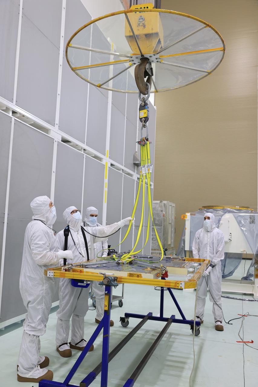 Technicians at the Astrotech Space Operations Facility near NASA’s Kennedy Space Center in Florida install the two-panel solar array on Thursday, July 17, 2025, that will help power the agency’s IMAP (Interstellar Mapping and Acceleration Probe) observatory on its upcoming journey one million miles away from Earth. Each panel of the solar array, located on the top of IMAP, consists of 16 strings of solar cells, with 36 cells per string, and combined will convert sunlight into 500 watts of power, more than enough for the observatory, which as a system uses less power than five 100-watt incandescent light bulbs.