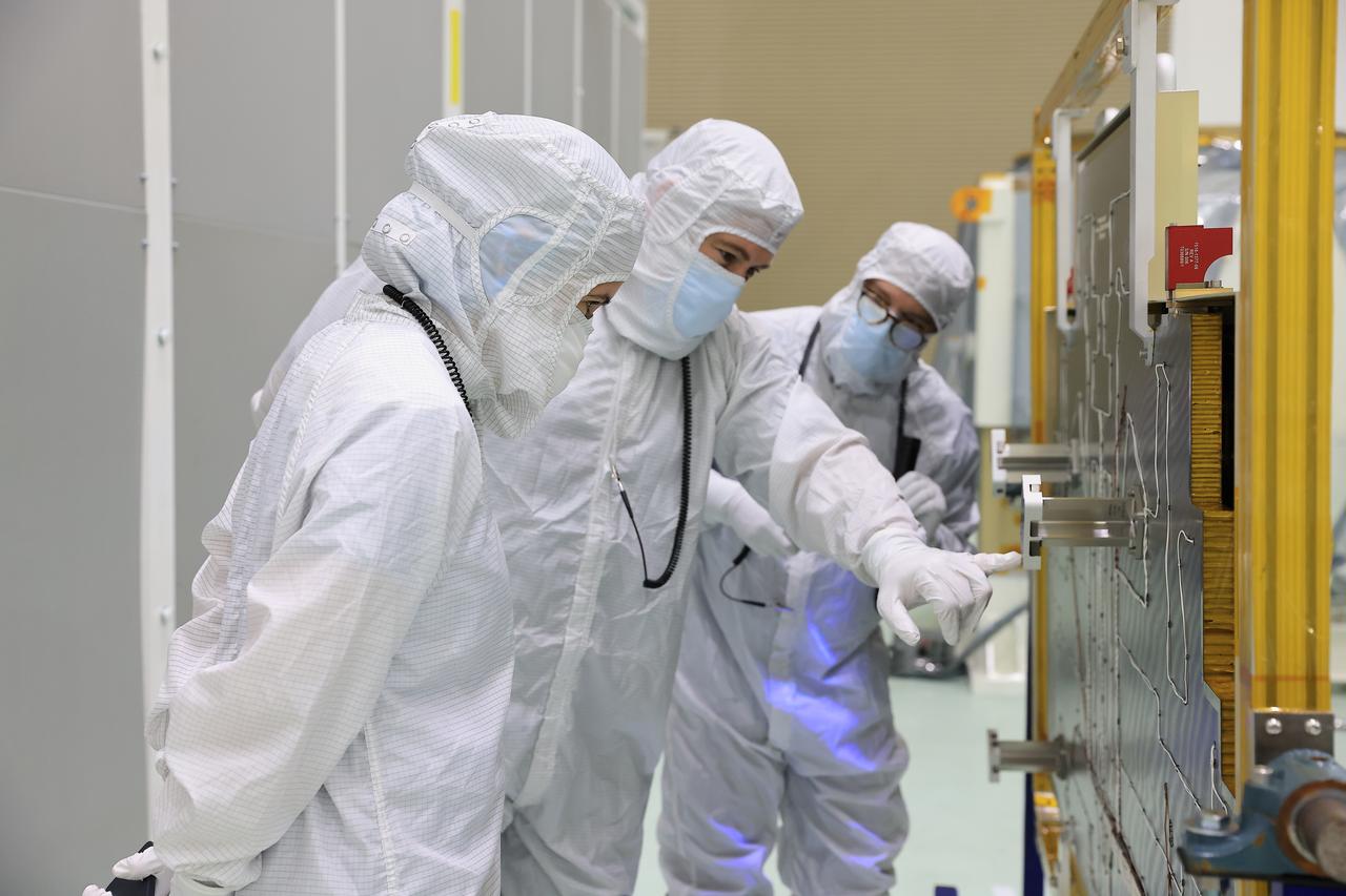 Technicians at the Astrotech Space Operations Facility near NASA’s Kennedy Space Center in Florida install the two-panel solar array on Thursday, July 17, 2025, that will help power the agency’s IMAP (Interstellar Mapping and Acceleration Probe) observatory on its upcoming journey one million miles away from Earth. Each panel of the solar array, located on the top of IMAP, consists of 16 strings of solar cells, with 36 cells per string, and combined will convert sunlight into 500 watts of power, more than enough for the observatory, which as a system uses less power than five 100-watt incandescent light bulbs.