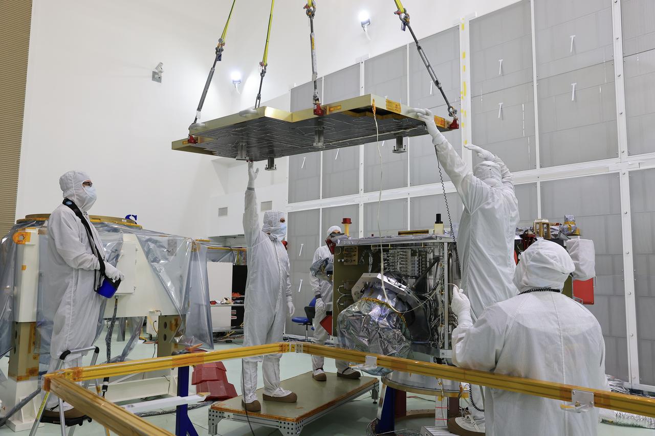 Technicians at the Astrotech Space Operations Facility near NASA’s Kennedy Space Center in Florida install the two-panel solar array on Thursday, July 17, 2025, that will help power the agency’s IMAP (Interstellar Mapping and Acceleration Probe) observatory on its upcoming journey one million miles away from Earth. Each panel of the solar array, located on the top of IMAP, consists of 16 strings of solar cells, with 36 cells per string, and combined will convert sunlight into 500 watts of power, more than enough for the observatory, which as a system uses less power than five 100-watt incandescent light bulbs.