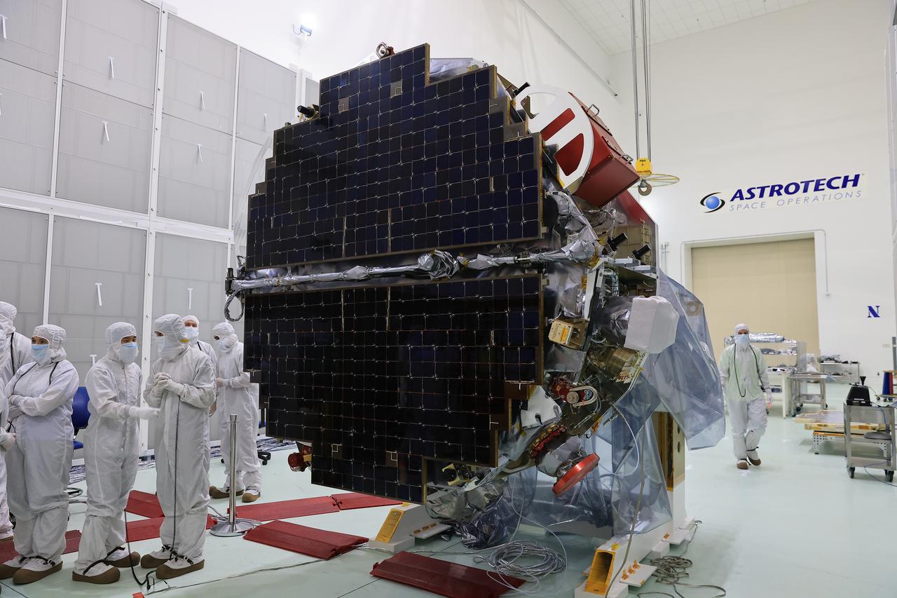 Technicians at the Astrotech Space Operations Facility near NASA’s Kennedy Space Center in Florida conduct illumination testing on Friday, July 18, 2025, by flashing a bright light that simulates the Sun into the two-panel solar array that will help power the agency’s IMAP (Interstellar Mapping and Acceleration Probe) observatory on its upcoming journey to a destination about one million miles away from Earth Lagrange Point 1. Each panel of the solar array, located on the top of IMAP, consists of 16 strings of solar cells, with 36 cells per string, and combined will convert sunlight into 500 watts of power, more than enough for the observatory, which as a system uses less power than five 100-watt incandescent light bulbs.  