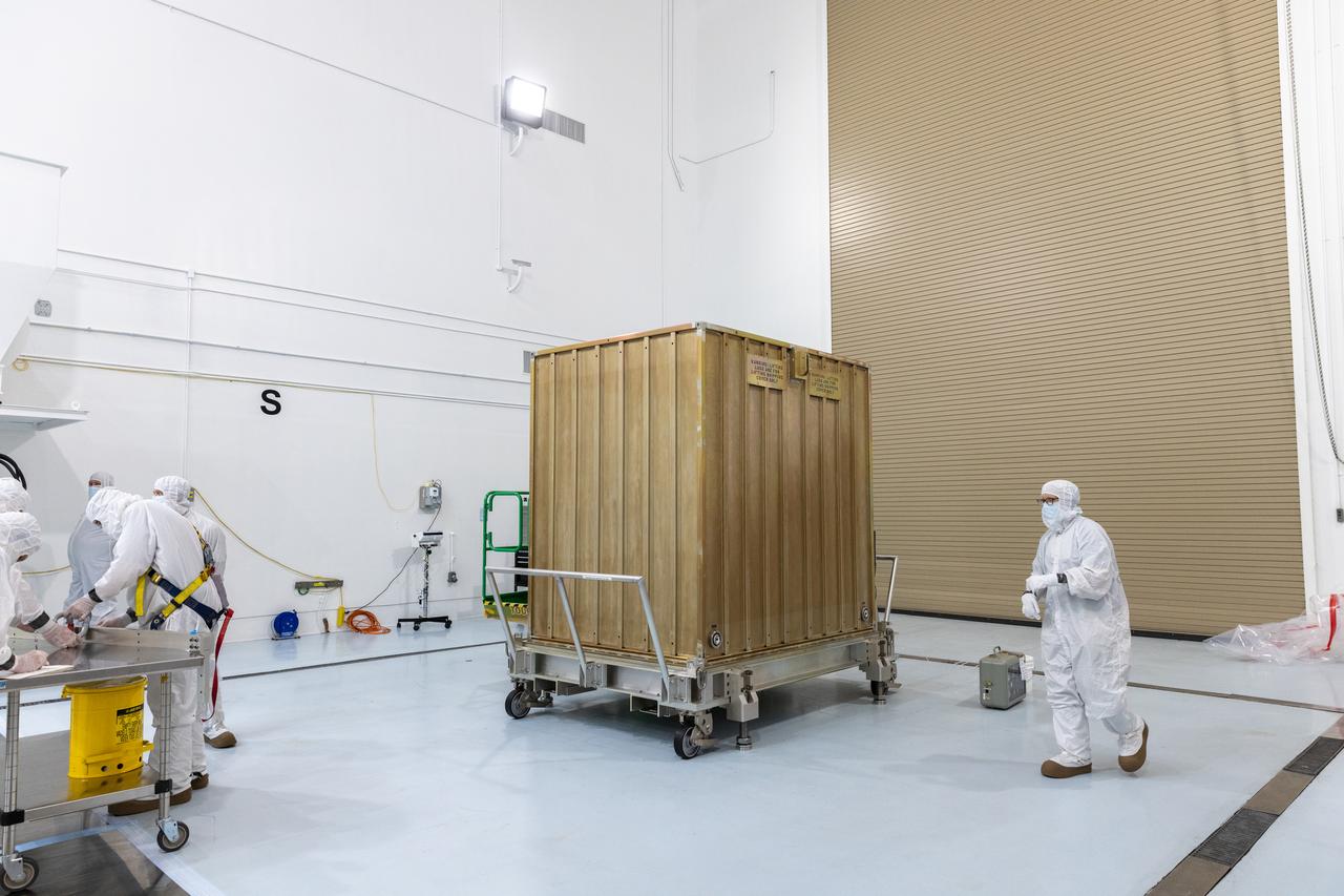 Technicians prepare to remove the protective casing covering NASA’s Carruthers Geocorona Observatory on Monday, July 21, 2025, at the Astrotech Space Operations Facility near the agency’s Kennedy Space Center in Florida. The Carruthers Geocorona Observatory is a small satellite set to operate at Lagrange Point 1 (L1), an orbit point between the Earth and Sun about one million miles away. Carruthers will use its ultraviolet cameras to monitor how space weather from the Sun impacts the exosphere, the outermost part of Earth’s atmosphere. The observatory will launch as a rideshare with NASA’s (Interstellar Mapping and Acceleration Probe) no earlier than September 2025.