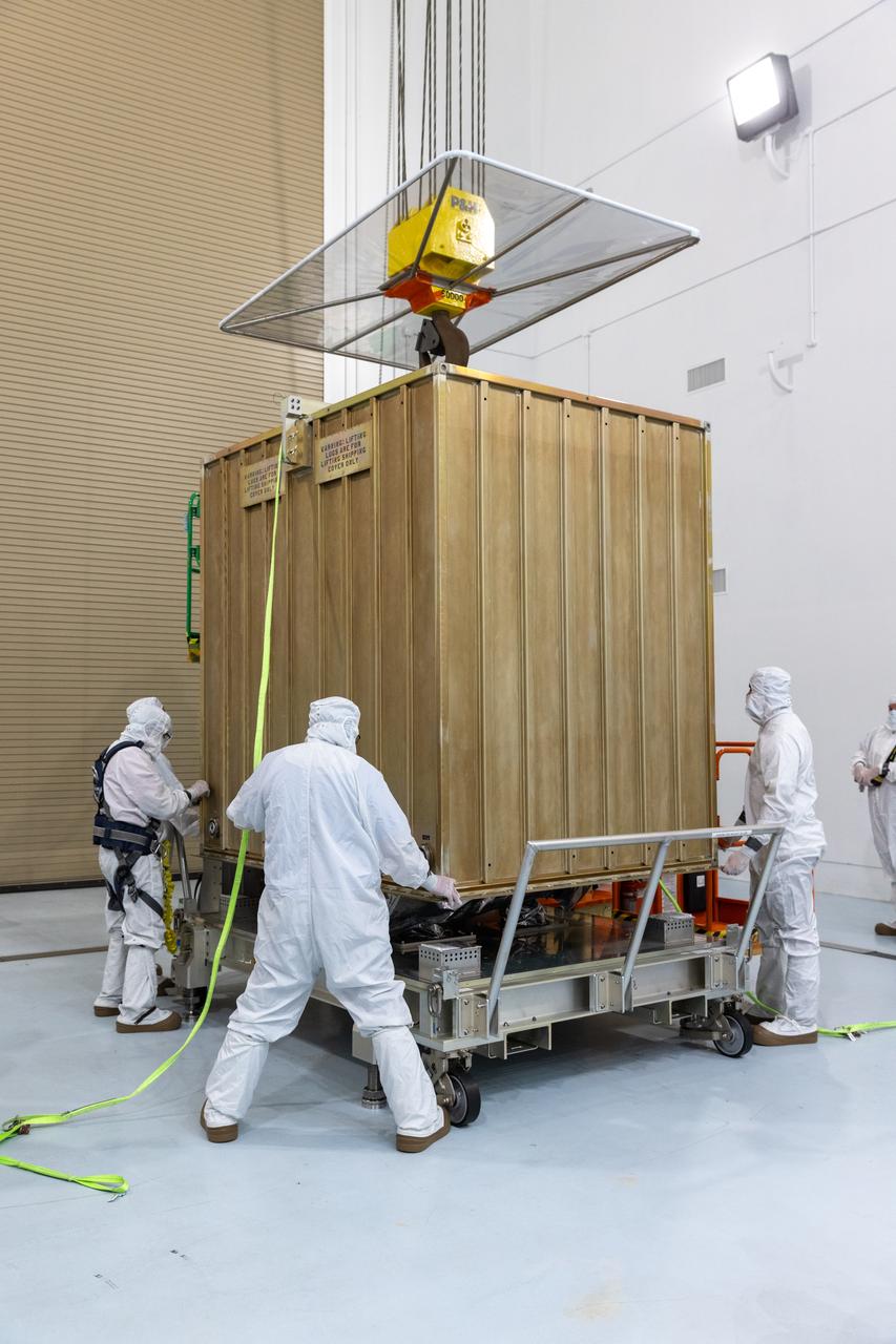 Technicians prepare to remove the protective casing covering NASA’s Carruthers Geocorona Observatory on Monday, July 21, 2025, at the Astrotech Space Operations Facility near the agency’s Kennedy Space Center in Florida. The Carruthers Geocorona Observatory is a small satellite set to operate at Lagrange Point 1 (L1), an orbit point between the Earth and Sun about one million miles away. Carruthers will use its ultraviolet cameras to monitor how space weather from the Sun impacts the exosphere, the outermost part of Earth’s atmosphere. The observatory will launch as a rideshare with NASA’s (Interstellar Mapping and Acceleration Probe) no earlier than September 2025.