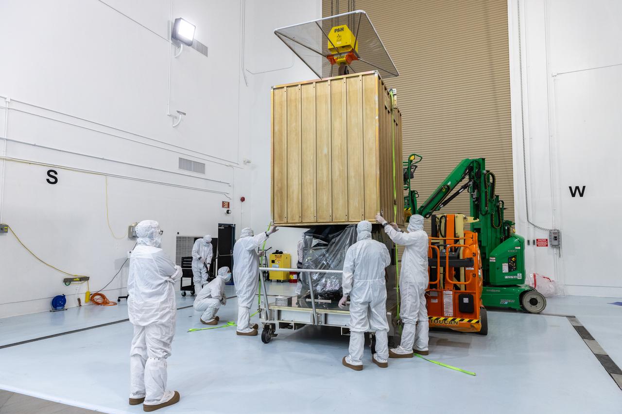 Technicians prepare to remove the protective casing covering NASA’s Carruthers Geocorona Observatory on Monday, July 21, 2025, at the Astrotech Space Operations Facility near the agency’s Kennedy Space Center in Florida. The Carruthers Geocorona Observatory is a small satellite set to operate at Lagrange Point 1 (L1), an orbit point between the Earth and Sun about one million miles away. Carruthers will use its ultraviolet cameras to monitor how space weather from the Sun impacts the exosphere, the outermost part of Earth’s atmosphere. The observatory will launch as a rideshare with NASA’s (Interstellar Mapping and Acceleration Probe) no earlier than September 2025.