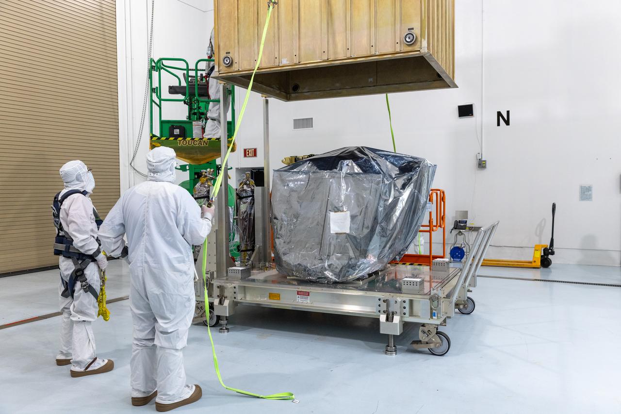 Technicians remove the protective casing covering NASA’s Carruthers Geocorona Observatory on Monday, July 21, 2025, at the Astrotech Space Operations Facility near the agency’s Kennedy Space Center in Florida. The Carruthers Geocorona Observatory is a small satellite set to operate at Lagrange Point 1 (L1), an orbit point between the Earth and Sun about one million miles away. Carruthers will use its ultraviolet cameras to monitor how space weather from the Sun impacts the exosphere, the outermost part of Earth’s atmosphere. The observatory will launch as a rideshare with NASA’s (Interstellar Mapping and Acceleration Probe) no earlier than September 2025.
