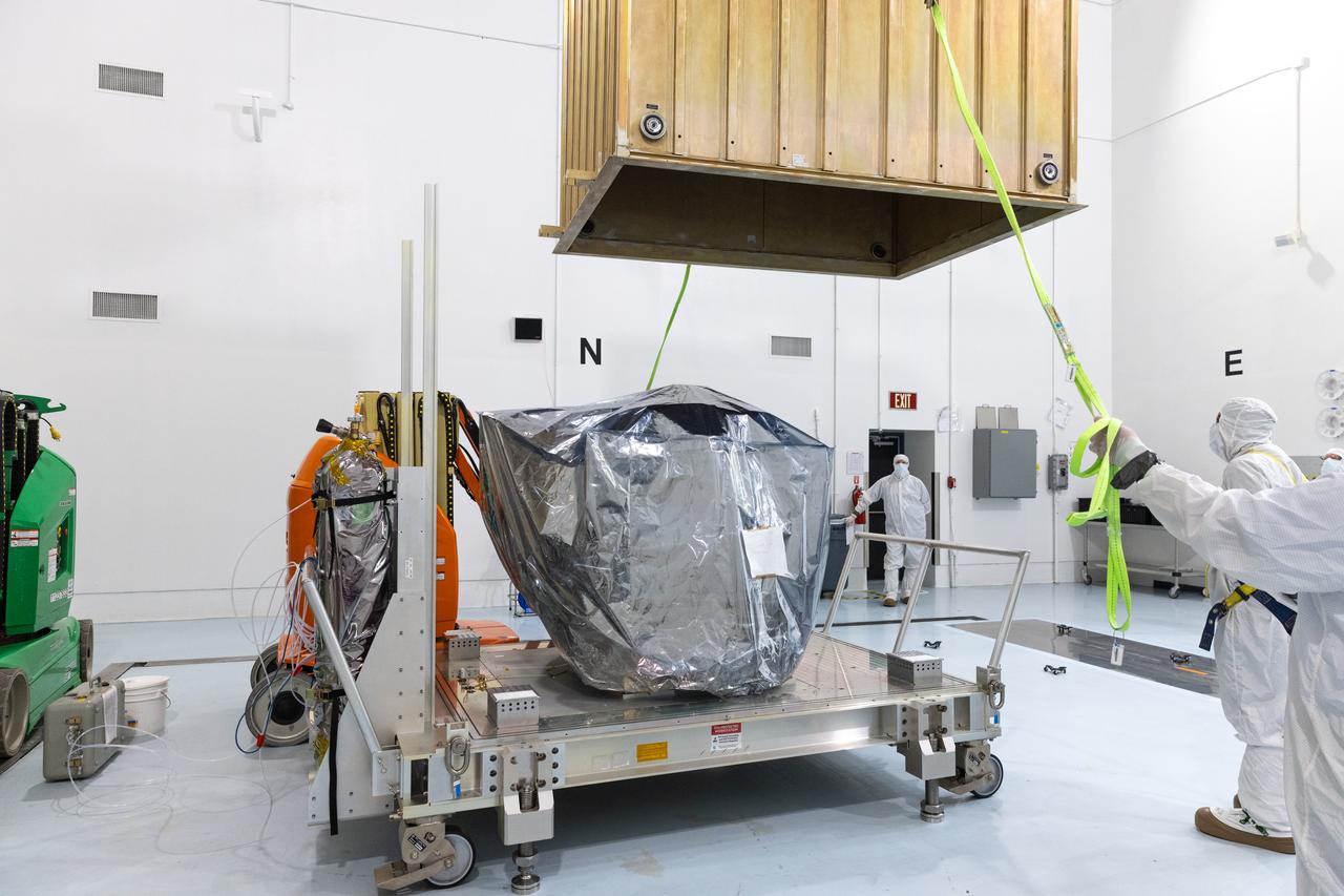 Technicians remove the protective casing covering NASA’s Carruthers Geocorona Observatory on Monday, July 21, 2025, at the Astrotech Space Operations Facility near the agency’s Kennedy Space Center in Florida. The Carruthers Geocorona Observatory is a small satellite set to operate at Lagrange Point 1 (L1), an orbit point between the Earth and Sun about one million miles away. Carruthers will use its ultraviolet cameras to monitor how space weather from the Sun impacts the exosphere, the outermost part of Earth’s atmosphere. The observatory will launch as a rideshare with NASA’s (Interstellar Mapping and Acceleration Probe) no earlier than September 2025.