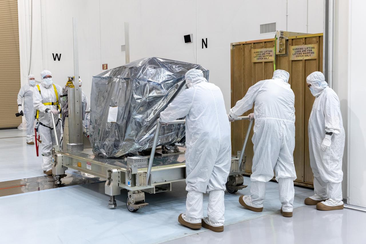 Technicians remove the protective casing covering NASA’s Carruthers Geocorona Observatory on Monday, July 21, 2025, at the Astrotech Space Operations Facility near the agency’s Kennedy Space Center in Florida. The Carruthers Geocorona Observatory is a small satellite set to operate at Lagrange Point 1 (L1), an orbit point between the Earth and Sun about one million miles away. Carruthers will use its ultraviolet cameras to monitor how space weather from the Sun impacts the exosphere, the outermost part of Earth’s atmosphere. The observatory will launch as a rideshare with NASA’s (Interstellar Mapping and Acceleration Probe) no earlier than September 2025.