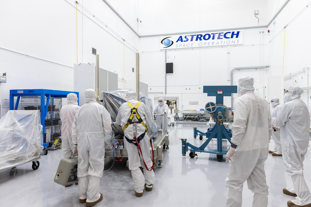 Technicians remove the protective casing covering NASA’s Carruthers Geocorona Observatory on Monday, July 21, 2025, at the Astrotech Space Operations Facility near the agency’s Kennedy Space Center in Florida. The Carruthers Geocorona Observatory is a small satellite set to operate at Lagrange Point 1 (L1), an orbit point between the Earth and Sun about one million miles away. Carruthers will use its ultraviolet cameras to monitor how space weather from the Sun impacts the exosphere, the outermost part of Earth’s atmosphere. The observatory will launch as a rideshare with NASA’s (Interstellar Mapping and Acceleration Probe) no earlier than September 2025.