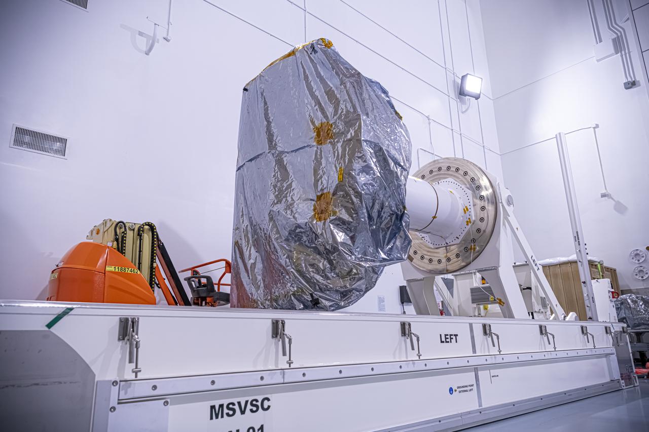 A photographer captures the National Oceanic and Atmospheric Administration’s (NOAA) Space Weather Follow On–Lagrange 1 (SWFO-L1) Observatory laying horizontal on Tuesday, July 22, 2025, following the arrival and unboxing of the observatory at the Astrotech Space Operations Facility near NASA’s Kennedy Space Center in Florida. The SWFO-L1 mission will monitor the Sun and near-Earth environment using a suite of instruments that provide real-time measurements of solar activity. The observatory will launch as a rideshare with NASA’s IMAP (Interstellar Mapping and Acceleration Probe) no earlier than September 2025.