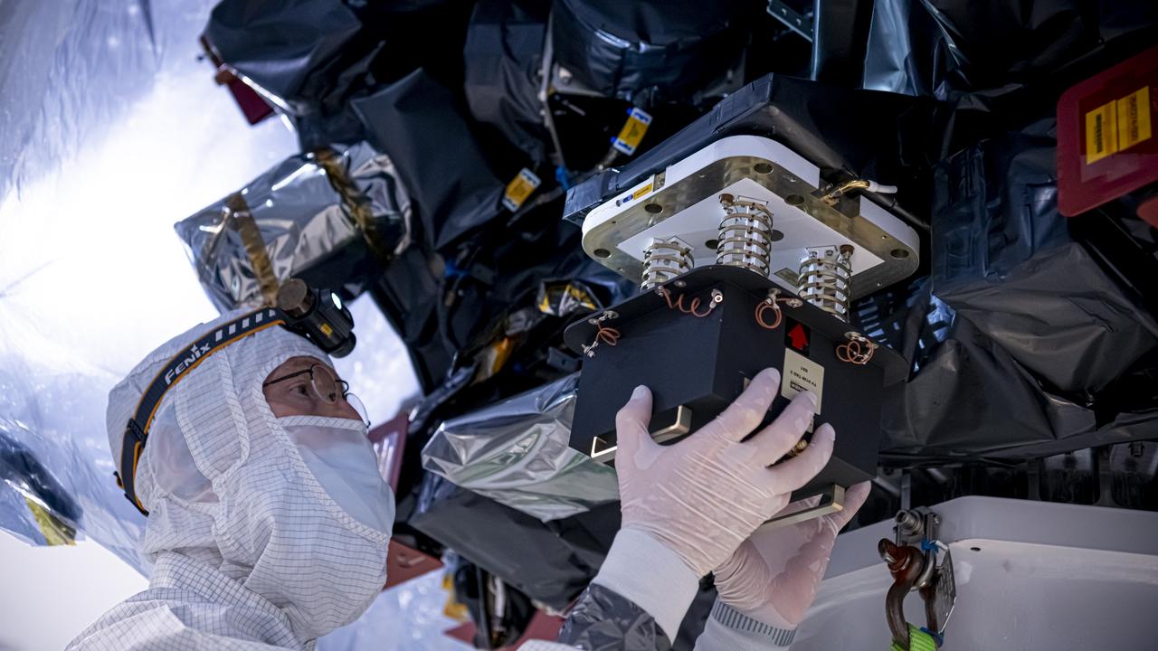 Technicians rotate the National Oceanic and Atmospheric Administration’s (NOAA) Space Weather Follow On–Lagrange 1 (SWFO-L1) Observatory vertically and use a crane to lift it from its transport container on Wednesday, July 23, 2025, following the arrival and unboxing of the observatory at the Astrotech Space Operations Facility near NASA’s Kennedy Space Center in Florida. The SWFO-L1 mission will monitor the Sun and near-Earth environment using a suite of instruments that provide real-time measurements of solar activity. The observatory will launch as a rideshare with NASA’s IMAP (Interstellar Mapping and Acceleration Probe) no earlier than September 2025.