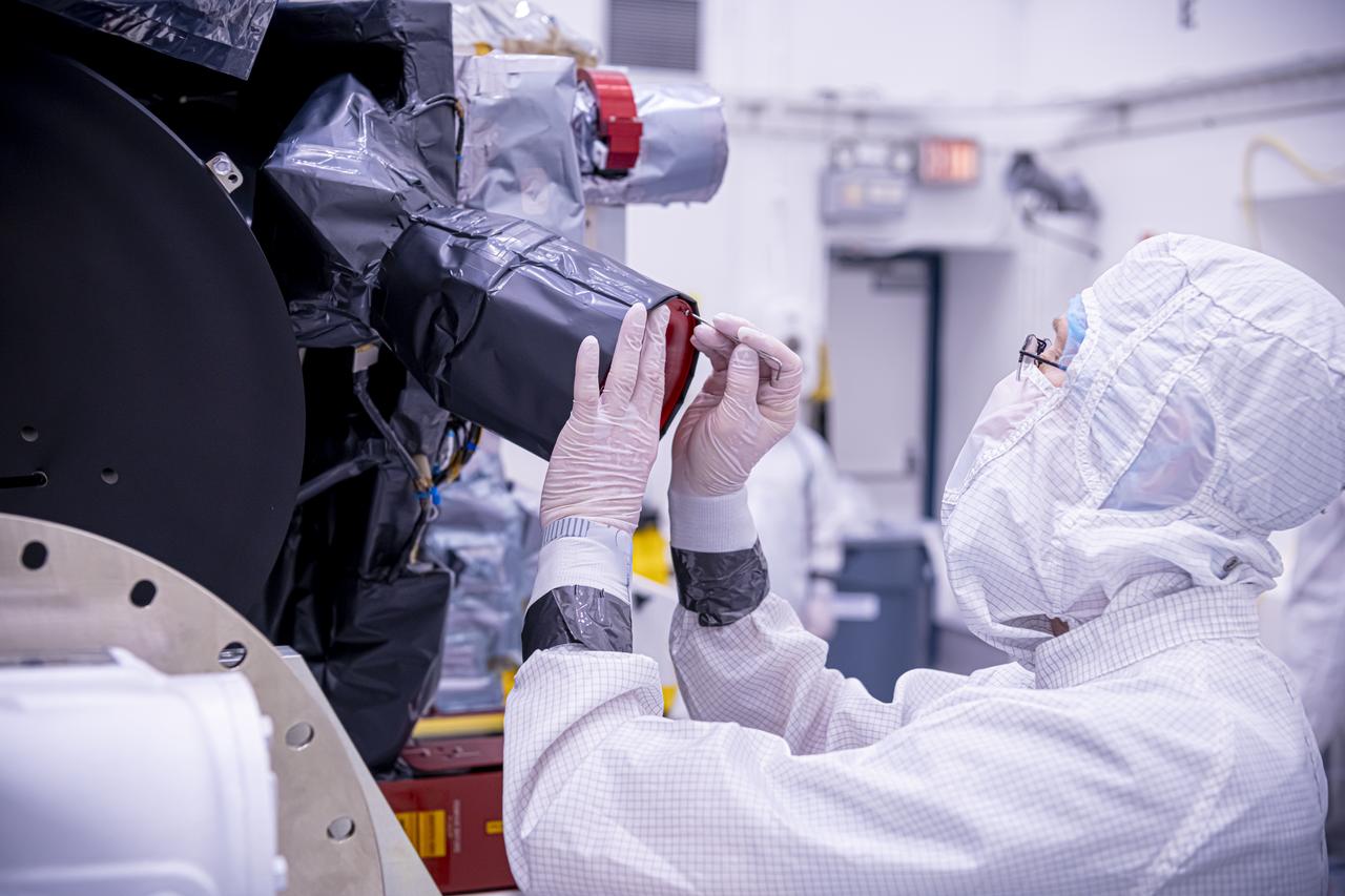 Technicians inspect the National Oceanic and Atmospheric Administration’s (NOAA) Space Weather Follow On–Lagrange 1 (SWFO-L1) Observatory on Thursday, July 24, 2025, following the arrival and unboxing of the observatory at the Astrotech Space Operations Facility near NASA’s Kennedy Space Center in Florida. The SWFO-L1 mission will monitor the Sun and near-Earth environment using a suite of instruments that provide real-time measurements of solar activity. The observatory will launch as a rideshare with NASA’s IMAP (Interstellar Mapping and Acceleration Probe) no earlier than September 2025.