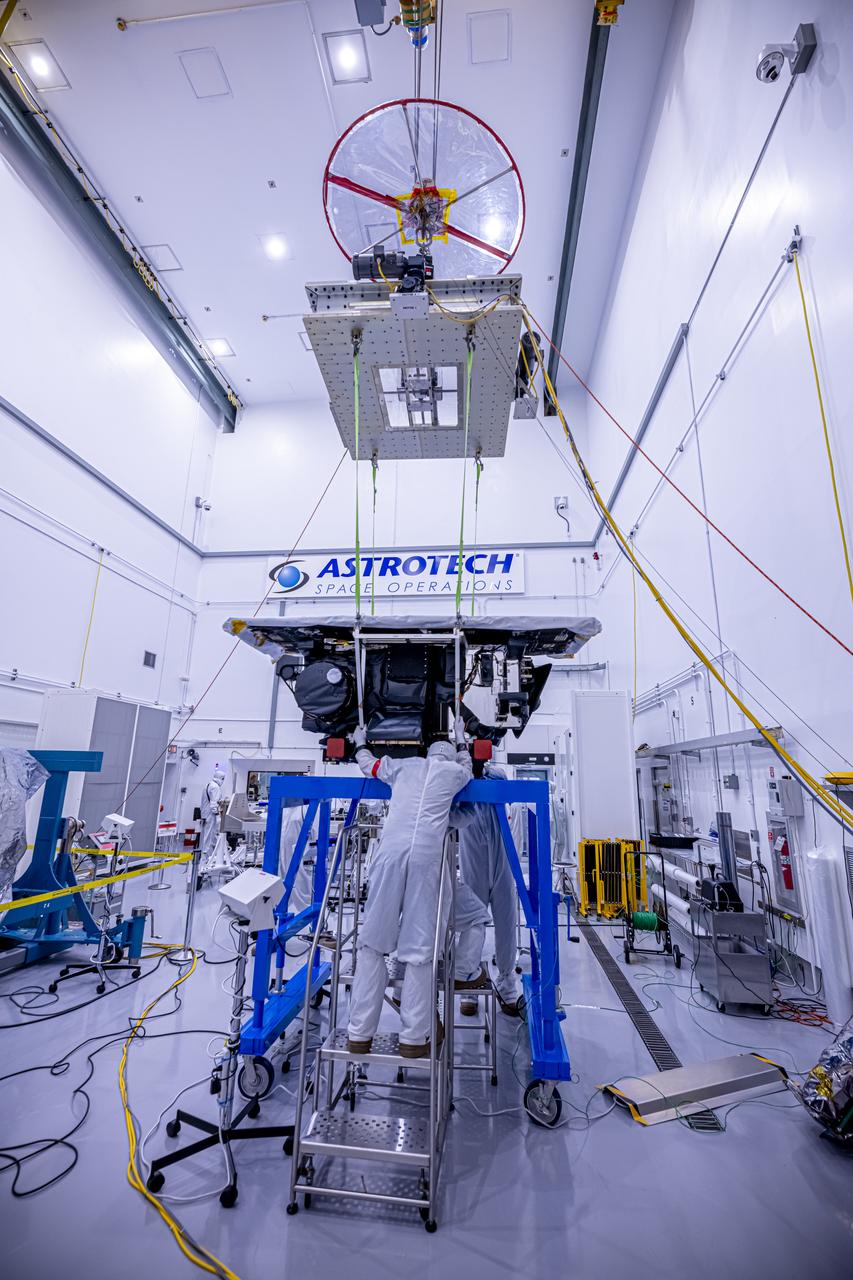 Technicians use a crane to lift the National Oceanic and Atmospheric Administration’s (NOAA) Space Weather Follow On–Lagrange 1 (SWFO-L1) Observatory onto a work stand on Friday, July 25, 2025, during prelaunch processing at the Astrotech Space Operations Facility near NASA’s Kennedy Space Center in Florida. The SWFO-L1 mission will observe solar eruptions, and monitor incoming space weather 24/7, providing early warnings and validating forecasts that protect vital communication and navigation infrastructure, economic interests, and national security, both on Earth and in space. The observatory will launch as a rideshare with NASA’s IMAP (Interstellar Mapping and Acceleration Probe) no earlier than September 2025.