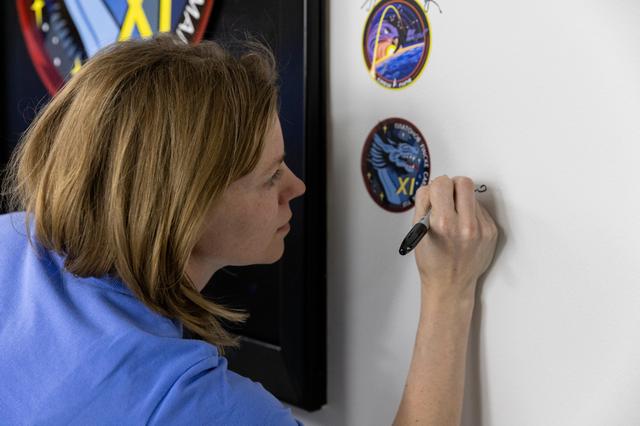 NASA image: Crew-11_Sign their mission patch on the wall