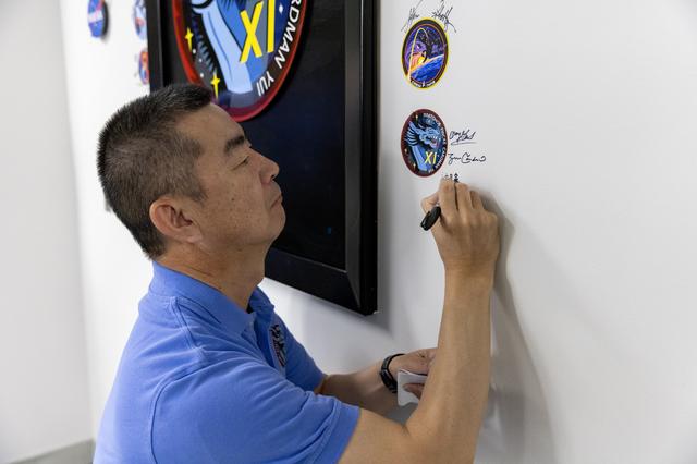 NASA image: Crew-11_Sign their mission patch on the wall