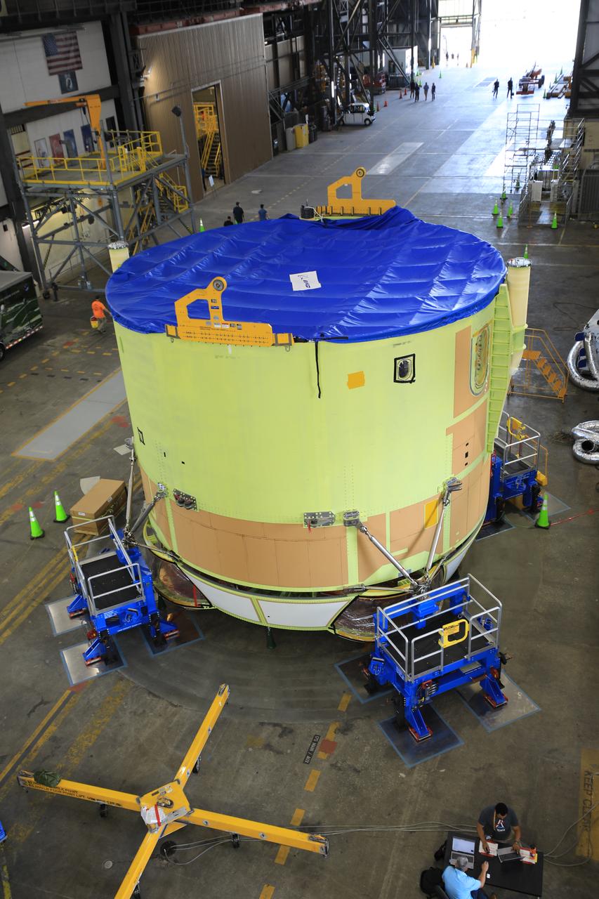 Teams from NASA’s Kennedy Space Center in Florida integrate NASA’s Artemis III SLS (Space Launch System) core stage engine section with its boat-tail inside the spaceport’s Vehicle Assembly Building on Wednesday, July 30, 2025. The boat-tail is a fairing-like structure that protects the bottom end of the core stage, while the engine section is one the most complex and intricate parts of the rocket stage that will help power the Artemis missions to the Moon. 