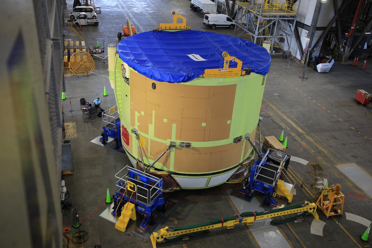 Teams from NASA’s Kennedy Space Center in Florida integrate NASA’s Artemis III SLS (Space Launch System) core stage engine section with its boat-tail inside the spaceport’s Vehicle Assembly Building on Wednesday, July 30, 2025. The boat-tail is a fairing-like structure that protects the bottom end of the core stage, while the engine section is one the most complex and intricate parts of the rocket stage that will help power the Artemis missions to the Moon. 