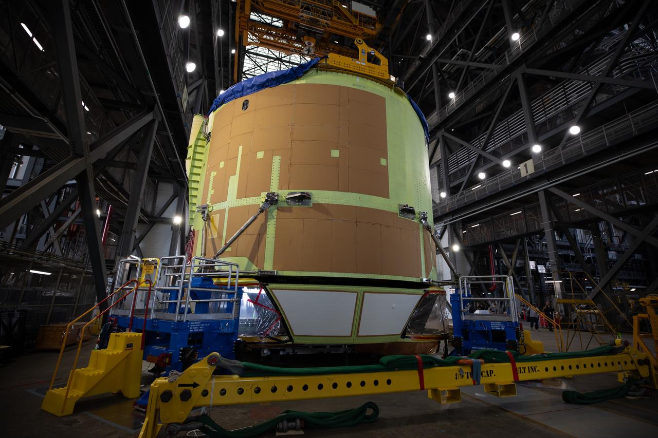 Teams from NASA’s Kennedy Space Center in Florida integrate NASA’s Artemis III SLS (Space Launch System) core stage engine section with its boat-tail inside the spaceport’s Vehicle Assembly Building on Wednesday, July 30, 2025. The boat-tail is a fairing-like structure that protects the bottom end of the core stage, while the engine section is one the most complex and intricate parts of the rocket stage that will help power the Artemis missions to the Moon. 