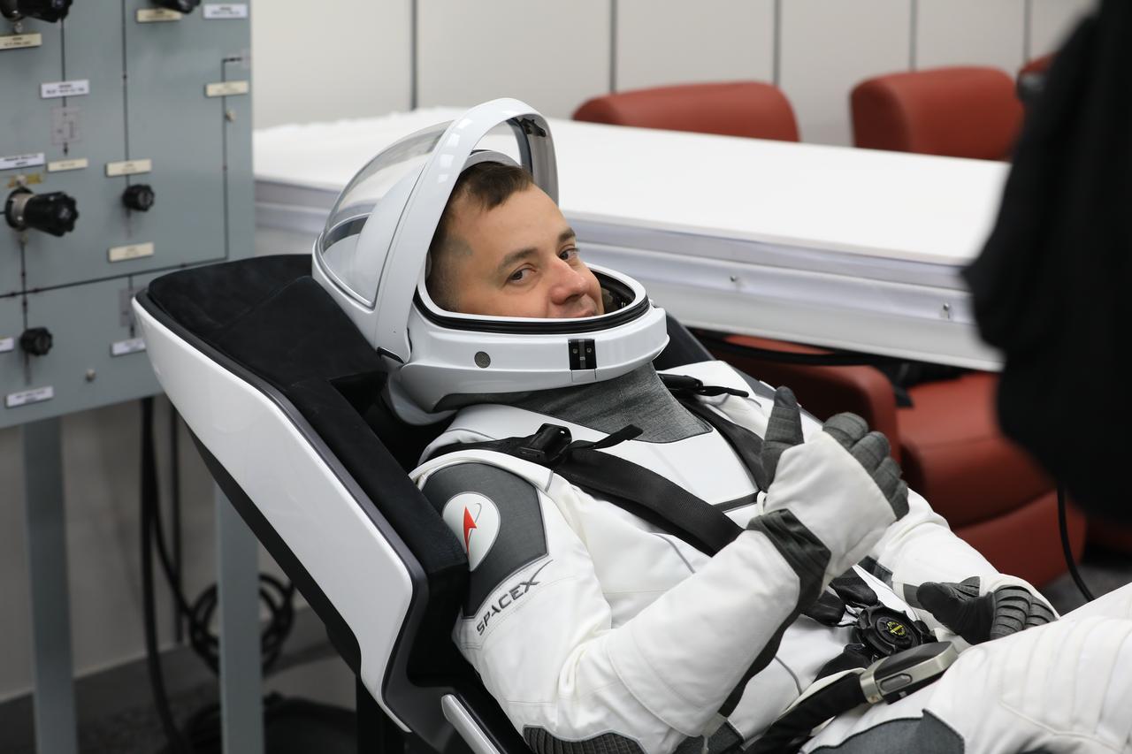 Roscosmos cosmonaut Oleg Platonov conducts leak checks for his SpaceX spacesuit inside the crew suit-up room in the Neil A. Armstrong Operations and Checkout Building at the agency’s Kennedy Space Center in Florida on Thursday, July 31, 2025, during its first attempt of NASA’s SpaceX Crew-11 mission to the International Space Station. NASA astronauts Zena Cardman and Mike Fincke, along with JAXA (Japan Aerospace Exploration Agency) astronaut Kimiya Yui and Platonov, are scheduled to lift off aboard SpaceX’s Dragon spacecraft and Falcon 9 rocket for its second attempt at 11:43 a.m. EDT Friday. Aug. 1, 2025, from Launch Complex 39A at NASA Kennedy. 