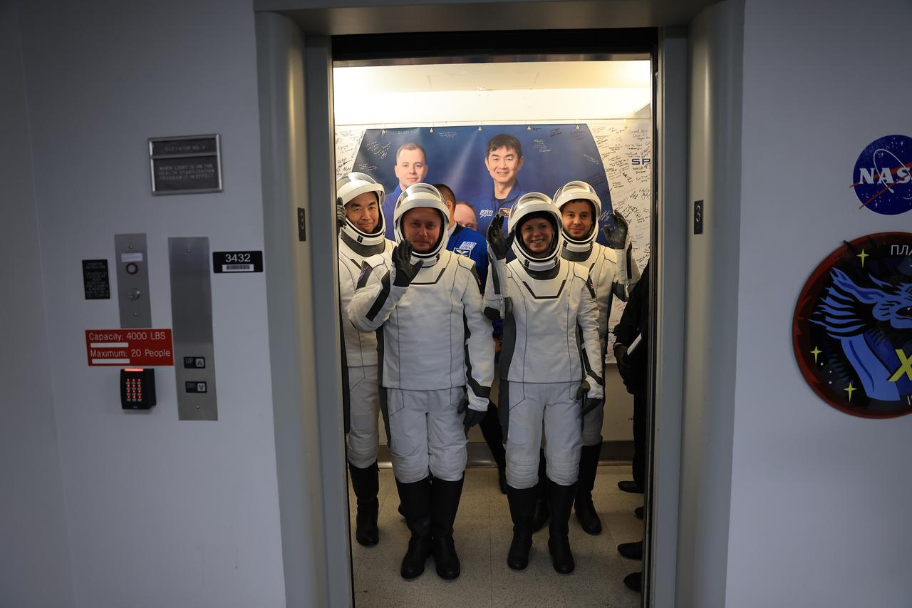 NASA’s SpaceX Crew-11 members pose for a photo in an elevator following suit up operations in the Neil A. Armstrong Operations and Checkout Building at the agency’s Kennedy Space Center in Florida on Thursday, July 31, 2025, during the first attempt of NASA’s SpaceX Crew-11 mission to the International Space Station. From top left, NASA astronauts Mike Fincke and Zena Cardman, along with JAXA (Japan Aerospace Exploration Agency) astronaut Kimiya Yui and Roscosmos cosmonaut Oleg Platonov, are scheduled to lift off aboard SpaceX’s Dragon spacecraft and Falcon 9 rocket for its second attempt at 11:43 a.m. EDT Friday, Aug. 1, 2025, from Launch Complex 39A at NASA Kennedy.