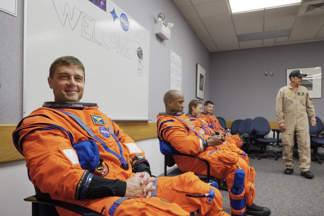 The crew of NASA’s Artemis II mission participates in a suited crew test on Thursday, July 31, 2025, at the agency’s Kennedy Space Center in Florida. From left, NASA astronauts Reid Wiseman, Artemis II commander; Victor Glover, Artemis II pilot; and Christina Koch, mission specialist; along with CSA (Canadian Space Agency) astronaut Jeremy Hansen,. mission specialist,  donned their Orion crew survival system spacesuits for training at NASA’s Kennedy’s Multi-Payload Processing Facility, where they entered their fully powered Orion spacecraft as part of the test. Artemis II will take the four astronauts around the Moon, as the first crewed mission on NASA’s path to establishing a long-term presence for science and exploration through Artemis.