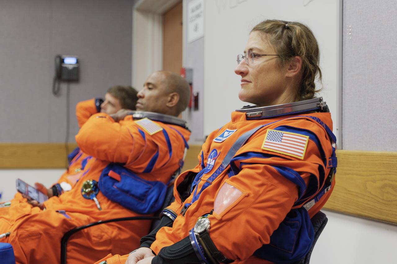 The crew of NASA’s Artemis II mission participates in a suited crew test on Thursday, July 31, 2025, at the agency’s Kennedy Space Center in Florida. From left, NASA astronauts Reid Wiseman, Artemis II commander; Victor Glover, Artemis II pilot; and Christina Koch, mission specialist, and CSA (Canadian Space Agency) Jeremy Hansen (not pictured), donned their Orion crew survival system spacesuits, for training at NASA’s Kennedy’s Multi-Payload Processing Facility, where they entered their fully powered Orion spacecraft as part of the test. Artemis II will take the four astronauts around the Moon, as the first crewed mission on NASA’s path to establishing a long-term presence for science and exploration through Artemis.