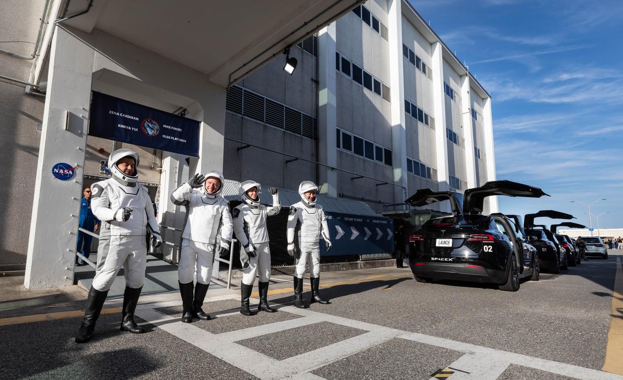 From right to left, JAXA (Japan Aerospace Exploration Agency) astronaut Kimiya Yui, NASA astronauts Zena Cardman and Mike Fincke, along with and Roscosmos cosmonaut Oleg Platonov wave to family and friends as they walk out of the Neil A. Armstrong Operations and Checkout Building at the agency’s Kennedy Space Center in Florida during the second launch attempt of NASA’s SpaceX Crew-11 mission to the International Space Station on Friday, Aug. 1, 2025. Crew-11 is scheduled to lift off aboard SpaceX’s Dragon spacecraft and Falcon 9 rocket at 11:43 a.m. EDT, from Launch Complex 39A at NASA Kennedy.