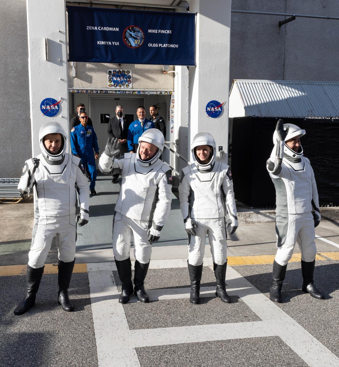 From right to left, JAXA (Japan Aerospace Exploration Agency) astronaut Kimiya Yui, NASA astronauts Zena Cardman and Mike Fincke, along with and Roscosmos cosmonaut Oleg Platonov wave to family and friends as they walk out of the Neil A. Armstrong Operations and Checkout Building at the agency’s Kennedy Space Center in Florida during the second launch attempt of NASA’s SpaceX Crew-11 mission to the International Space Station on Friday, Aug. 1, 2025. Crew-11 is scheduled to lift off aboard SpaceX’s Dragon spacecraft and Falcon 9 rocket at 11:43 a.m. EDT, from Launch Complex 39A at NASA Kennedy.