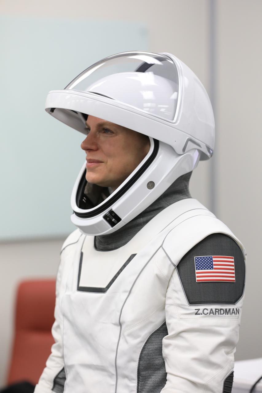 NASA astronaut Zena Cardman conducts leak checks for her SpaceX spacesuit inside the crew suit-up room in the Neil A. Armstrong Operations and Checkout Building at the agency’s Kennedy Space Center in Florida during the second launch attempt of NASA’s SpaceX Crew-11 mission to the International Space Station on Friday, Aug. 1, 2025. Cardman and fellow NASA astronaut Mike Fincke, along with JAXA (Japan Aerospace Exploration Agency) astronaut Kimiya Yui and Roscosmos cosmonaut Oleg Platonov, are scheduled to lift off aboard SpaceX’s Dragon spacecraft and Falcon 9 rocket at 11:43 a.m. EDT, from Launch Complex 39A at NASA Kennedy.