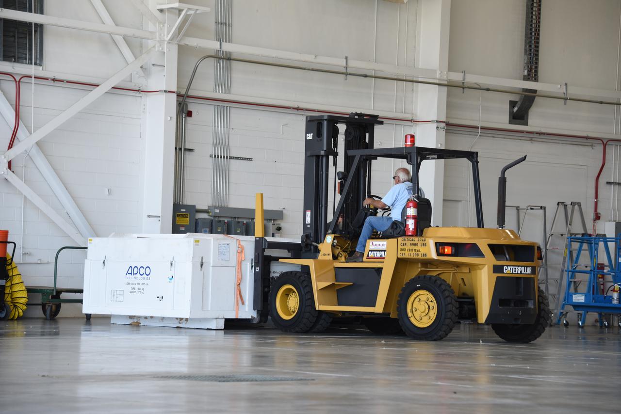 Ground support equipment for the Sentinel-6B spacecraft, a collaboration between NASA, ESA (European Space Agency), EUMETSAT (European Organisation for the Exploitation of Meteorological Satellites), and the National Oceanic and Atmospheric Administration (NOAA), is offloaded inside NASA’s Building 836 at Vandenberg Space Force Base in California on Monday, Aug. 18, 2025. The second of two spacecraft that constitutes the Sentinel-6/Jason-CS (Continuity of Service) mission, Sentinel-6B will measure sea surface height and provide crucial information to help improve coastal planning, enabling local and state governments to make informed decisions about protecting coastal infrastructure, real estate, and energy sites. Launch is targeted for no earlier than November on a SpaceX Falcon 9 from Vandenberg.