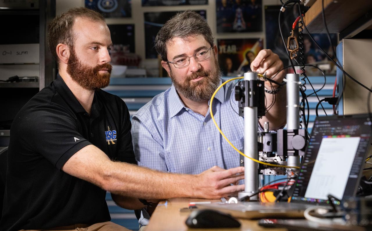 Left to right, Stefan Tomovic from the Engineering Directorate at NASA’s Kennedy Space Center in Florida and Christopher Biagi from the agency’s Exploration Research & Technology Program evaluate pressure transducers for NASA’s Engineering and Safety Center on Wednesday, Aug. 20, 2025. This probe is designed to improve the detection of thruster pressure sensor anomalies for the agency’s Commercial Crew Program.