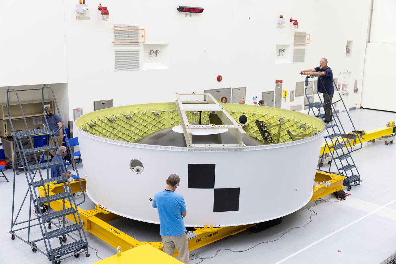 Technicians at NASA’s Kennedy Space Center in Florida complete routine inspections the Artemis II Orion stage adapter on Wednesday, Aug. 20, 2025, to the spaceport’s Multi-Payload Processing Facility to undergo CubeSat integration following its arrival from the agency’s Marshall Space Flight Center in Huntsville, Alabama. NASA Marshall built the Orion stage adapter which connects to the SLS (Space Launch System) rocket’s interim cryogenic propulsion stage to the Orion spacecraft and protects Orion from flammable gases generated during launch. The Artemis II test flight will take four astronauts around the Moon and return them back home in early 2026.