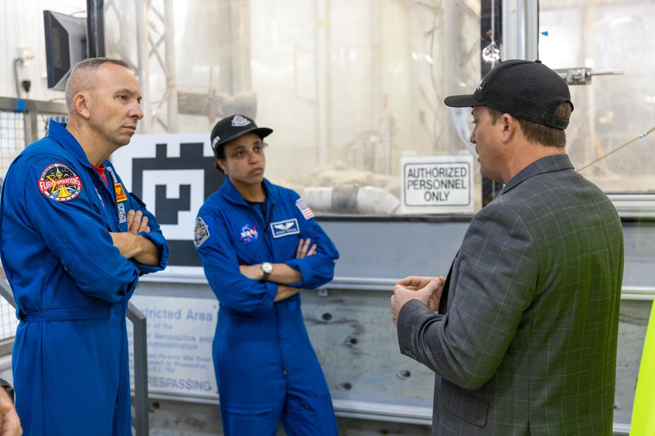 NASA astronauts Randy Bresnik (left) and Jessica Watkins (center) visit the Granular Mechanics and Regolith Operations Laboratory inside Swamp Works at Kennedy Space Center in Florida on Wednesday, Aug. 27, 2025, to view some of the evolving technologies in development that astronauts may use to explore the Moon’s surface, prepare it for sustainable outposts, and to handle the dust that is collected during moonwalks.