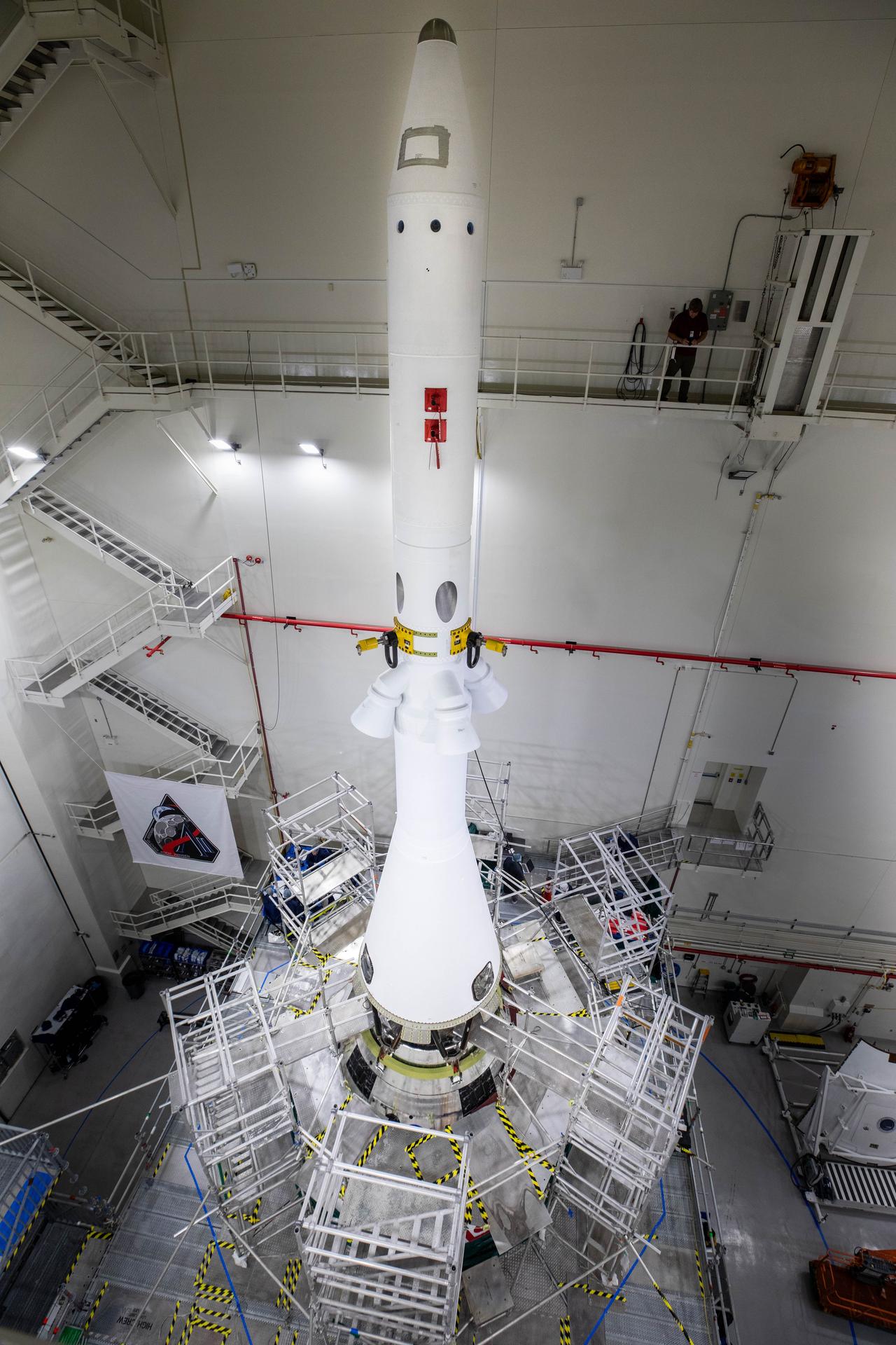 Image shows the white launch abort system attached to NASA's Orion spacecraft at NASA's Kennedy Space Center in Florida. The launch abort system is designed to carry the crew to safety in the event of an emergency atop the SLS. Photo credit: Cory Huston