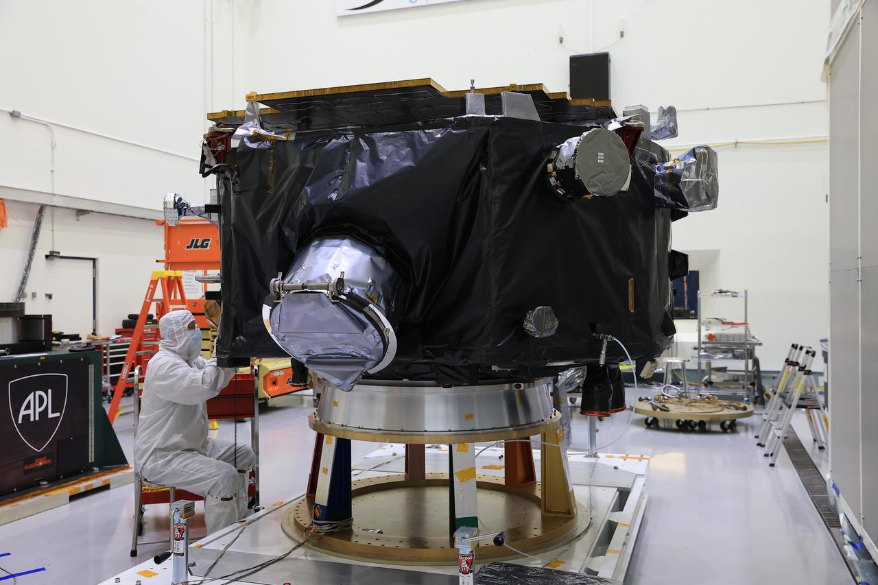 Technicians inspect NASA’s IMAP (Interstellar Mapping and Acceleration Probe) spacecraft on a spacecraft dolly inside Astrotech Space Operations Facility near the agency’s Kennedy Space Center in Florida during a NASA-hosted media day on Thursday, Aug. 28, 2025. IMAP and its two rideshares – NASA’s Carruthers Geocorona Observatory and National Oceanic and Atmospheric Administration’s (NOAA) Space Weather Follow On–Lagrange 1 (SWFO-L1) observatory – will orbit the Sun near Lagrange point 1, about one million miles from Earth, where IMAP will scan the heliosphere, a huge bubble created by the Sun’s wind that encapsulates our entire solar system, and analyze the composition of charged particles, and investigate how those particles move through the solar system.