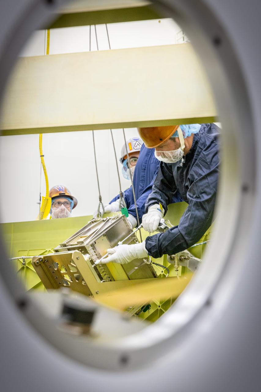 Technicians install the Korea AeroSpace Administration (KASA) K-Rad Cube within the Orion stage adapter inside the Multi-Payload Processing Facility at NASA’s Kennedy Space Center in Florida on Tuesday, Sept. 2, 2025. The K-Rad Cube, about the size of a shoebox, is one of the CubeSats slated to fly on NASA’s Artemis II test flight in 2026. Deploying in high Earth orbit from a spacecraft adapter on NASA’s SLS (Space Launch System) rocket after Orion is safely flying on its own with its crew of four astronauts, K-Rad Cube will use a dosimeter made of material designed to mimic human tissue to measure space radiation and assess biological effects at various altitudes across the Van Allen radiation belts, a critical area of research for human presence at the Moon and Mars.