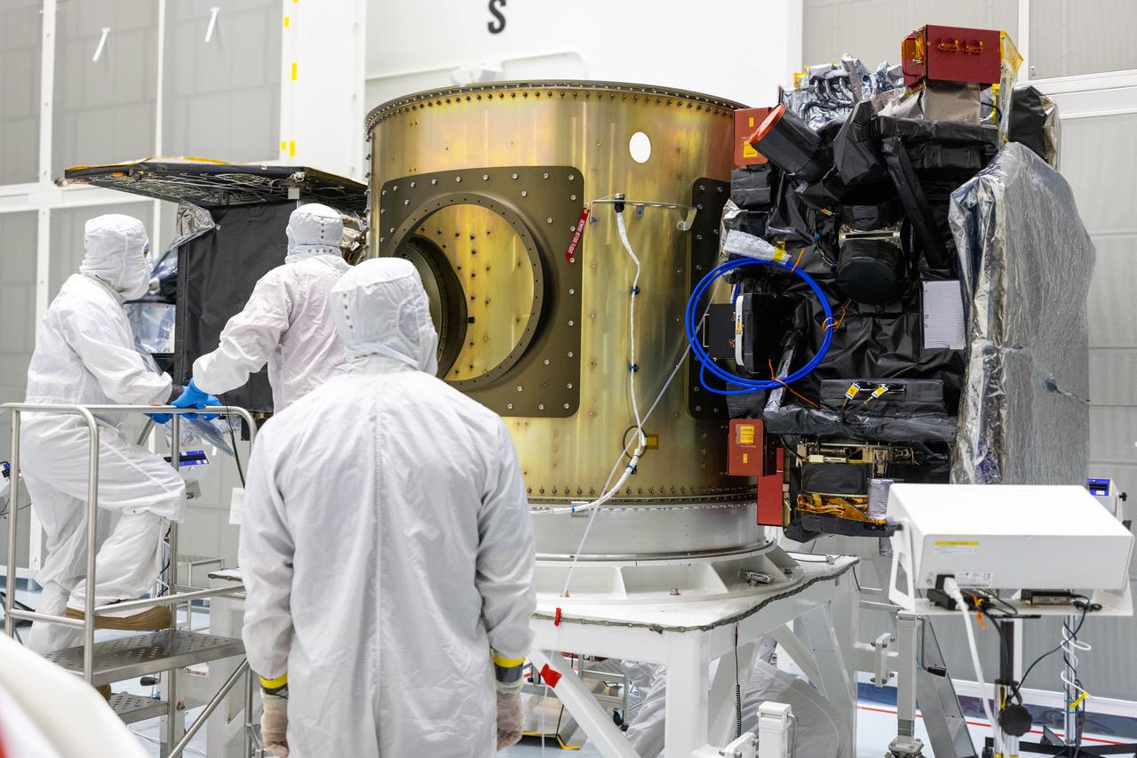 Technicians integrate NASA’s Carruthers Geocorona Observatory and the National Oceanic and Atmospheric Administration’s (NOAA) Space Weather Follow On Lagrange - 1 (SWFO-L1) satellite to the Evolved Expendable Launch Vehicle Secondary Payload Adapter Array Ring (ESPA) inside the Astrotech Space Operations Facility near NASA’s Kennedy Space Center in Florida on Friday, Sept. 5, 2025. The integration of the rideshares prepares for the next milestone of attaching NASA’s IMAP (Interstellar Mapping and Acceleration Probe) Sun mapping observatory to a payload adapter and stacking all three observatories together to prepare them for encapsulation in the payload fairing.