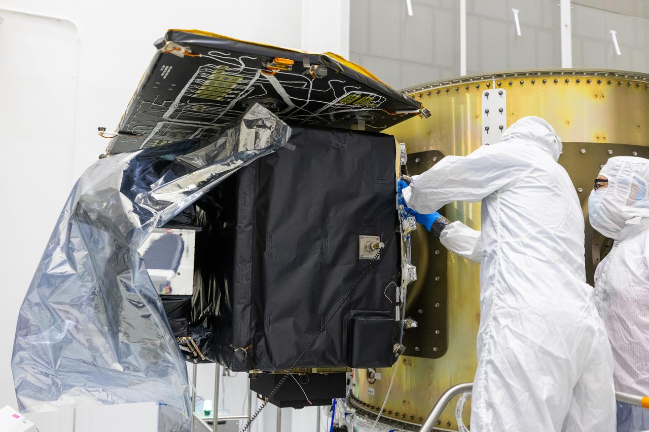Technicians integrate NASA’s Carruthers Geocorona Observatory and the National Oceanic and Atmospheric Administration’s (NOAA) Space Weather Follow On Lagrange - 1 (SWFO-L1) satellite to the Evolved Expendable Launch Vehicle Secondary Payload Adapter Array Ring (ESPA) inside the Astrotech Space Operations Facility near NASA’s Kennedy Space Center in Florida on Friday, Sept. 5, 2025. The integration of the rideshares prepares for the next milestone of attaching NASA’s IMAP (Interstellar Mapping and Acceleration Probe) Sun mapping observatory to a payload adapter and stacking all three observatories together to prepare them for encapsulation in the payload fairing.