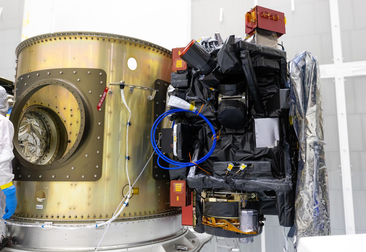 Technicians integrate NASA’s Carruthers Geocorona Observatory and the National Oceanic and Atmospheric Administration’s (NOAA) Space Weather Follow On Lagrange - 1 (SWFO-L1) satellite to the Evolved Expendable Launch Vehicle Secondary Payload Adapter Array Ring (ESPA) inside the Astrotech Space Operations Facility near NASA’s Kennedy Space Center in Florida on Friday, Sept. 5, 2025. The integration of the rideshares prepares for the next milestone of attaching NASA’s IMAP (Interstellar Mapping and Acceleration Probe) Sun mapping observatory to a payload adapter and stacking all three observatories together to prepare them for encapsulation in the payload fairing.