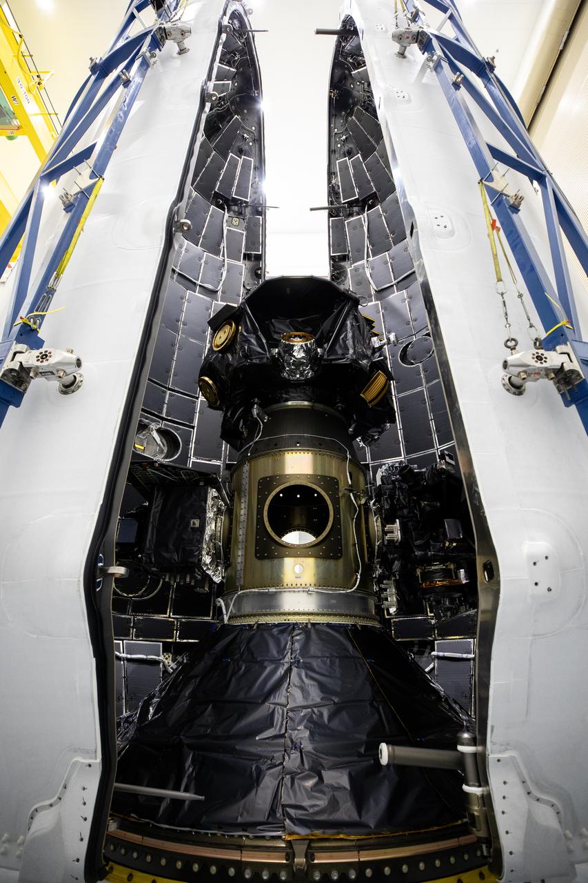 Technicians at Astrotech Space Operations Facility near NASA’s Kennedy Space Center in Florida encapsulate NASA’s IMAP (Interstellar Mapping and Acceleration Probe), along with the agency’s Carruthers Geocorona Observatory and National Oceanic and Atmospheric Administration’s (NOAA) Space Weather Follow On–Lagrange 1 (SWFO-L1) spacecraft on Tuesday, Sept. 16, 2025, inside a SpaceX Falcon 9 payload fairing. The missions will each focus on different effects of the solar wind — the continuous stream of particles emitted by the Sun — and space weather — the changing conditions in space driven by the Sun — from their origins at the Sun to their farthest reaches billions of miles away at the edge of our solar system. Liftoff of the missions on a SpaceX Falcon 9 rocket is targeted for 7:32 a.m. EDT, Tuesday, Sept. 23, from Launch Complex 39A at NASA Kennedy.