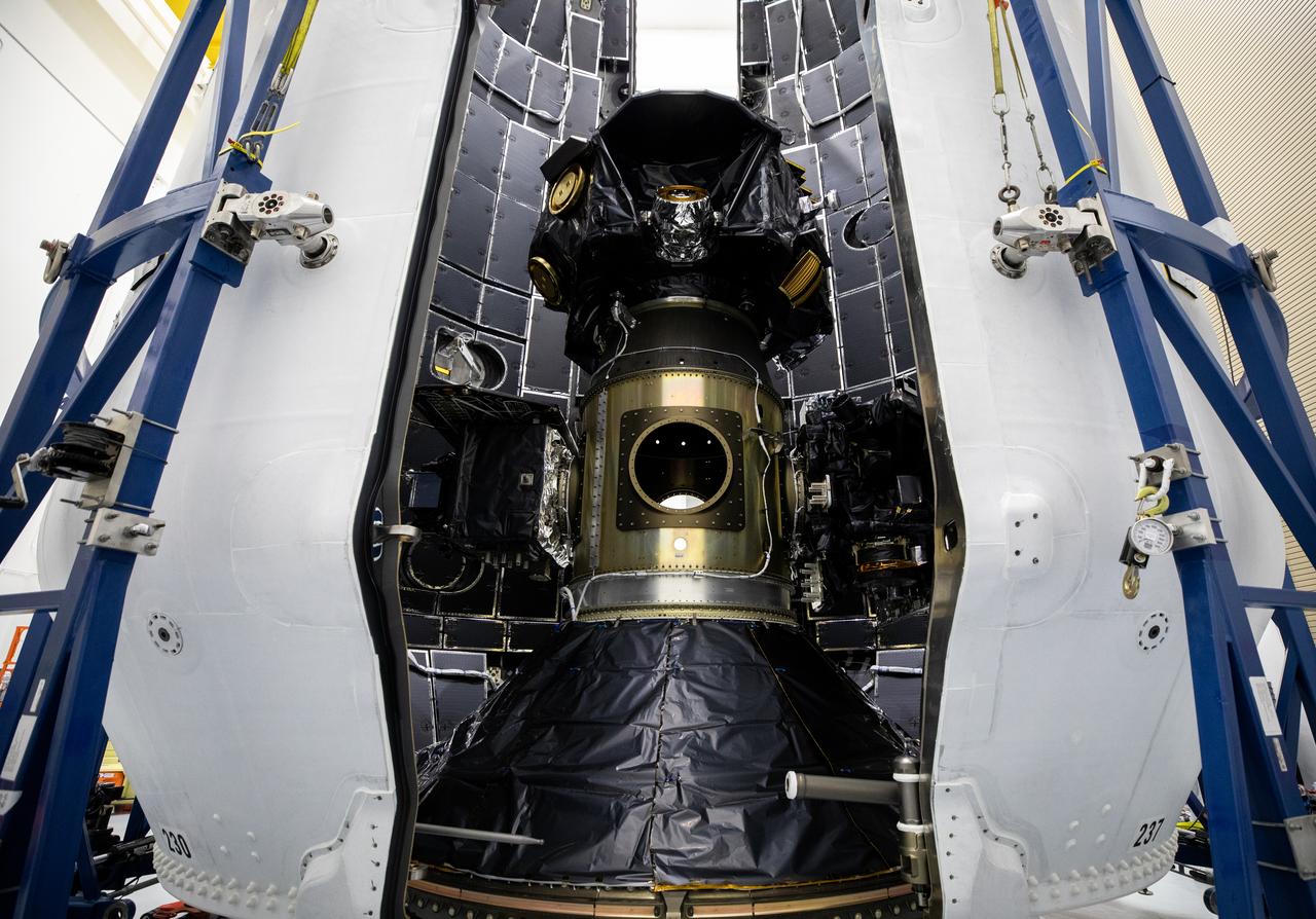 Technicians at Astrotech Space Operations Facility near NASA’s Kennedy Space Center in Florida encapsulate NASA’s IMAP (Interstellar Mapping and Acceleration Probe), along with the agency’s Carruthers Geocorona Observatory and National Oceanic and Atmospheric Administration’s (NOAA) Space Weather Follow On–Lagrange 1 (SWFO-L1) spacecraft on Tuesday, Sept. 16, 2025, inside a SpaceX Falcon 9 payload fairing. The missions will each focus on different effects of the solar wind — the continuous stream of particles emitted by the Sun — and space weather — the changing conditions in space driven by the Sun — from their origins at the Sun to their farthest reaches billions of miles away at the edge of our solar system. Liftoff of the missions on a SpaceX Falcon 9 rocket is targeted for 7:32 a.m. EDT, Tuesday, Sept. 23, from Launch Complex 39A at NASA Kennedy.