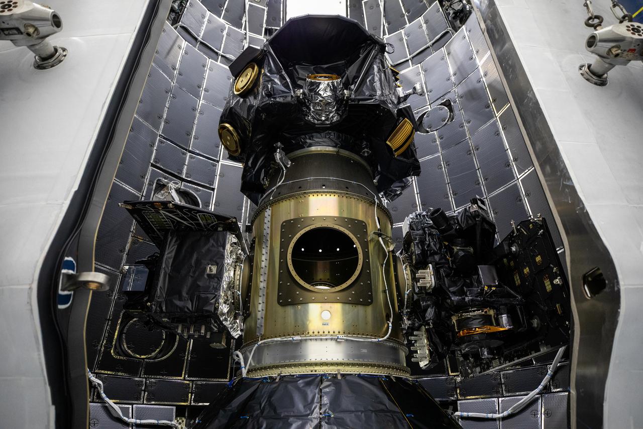 Technicians at Astrotech Space Operations Facility near NASA’s Kennedy Space Center in Florida encapsulate NASA’s IMAP (Interstellar Mapping and Acceleration Probe), along with the agency’s Carruthers Geocorona Observatory and National Oceanic and Atmospheric Administration’s (NOAA) Space Weather Follow On–Lagrange 1 (SWFO-L1) spacecraft on Tuesday, Sept. 16, 2025, inside a SpaceX Falcon 9 payload fairing. The missions will each focus on different effects of the solar wind — the continuous stream of particles emitted by the Sun — and space weather — the changing conditions in space driven by the Sun — from their origins at the Sun to their farthest reaches billions of miles away at the edge of our solar system. Liftoff of the missions on a SpaceX Falcon 9 rocket is targeted for 7:32 a.m. EDT, Tuesday, Sept. 23, from Launch Complex 39A at NASA Kennedy.